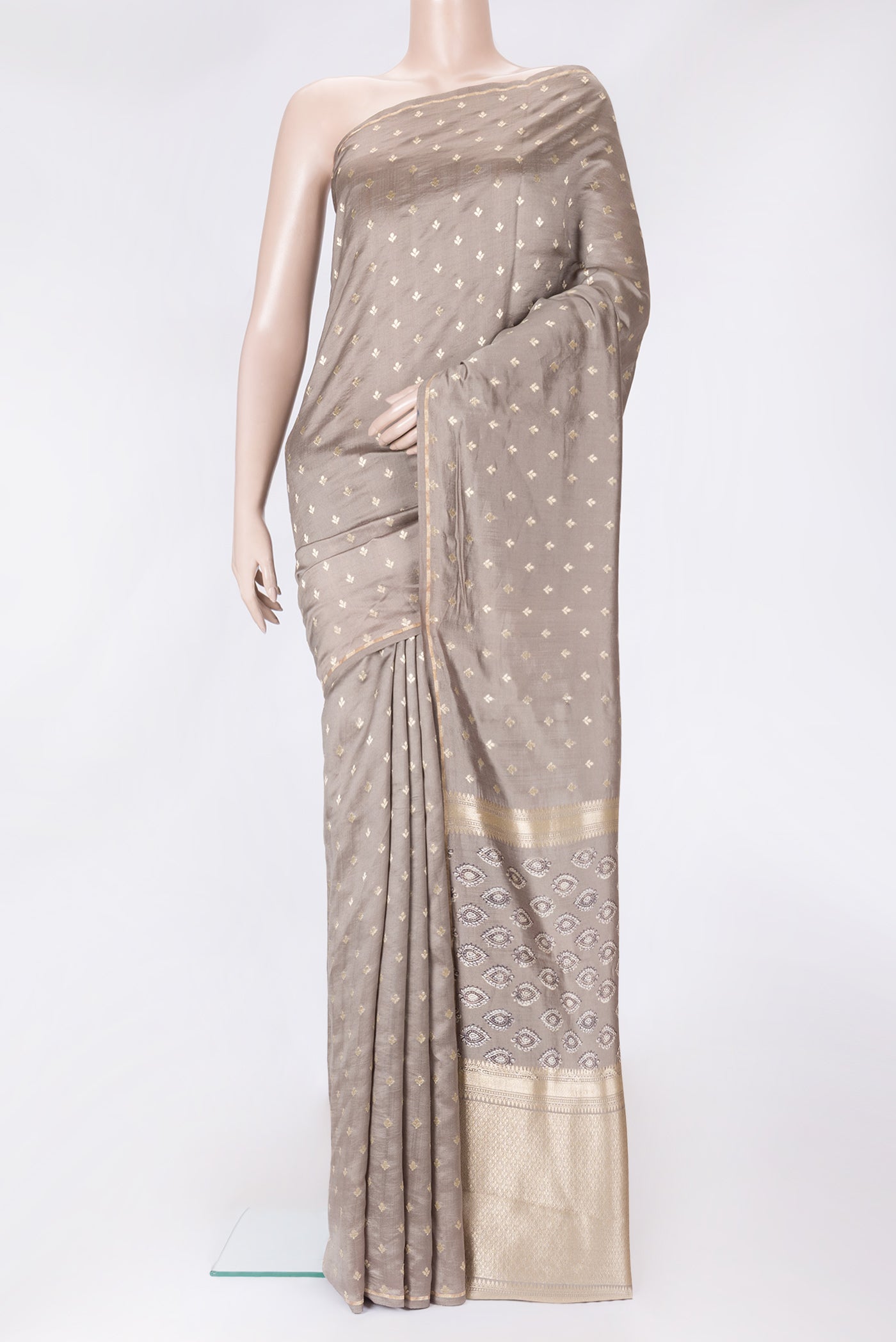 Grey Dual Tone Tussar Silk Saree with Printed design on the body and Zari Border.  displayed on a mannequin