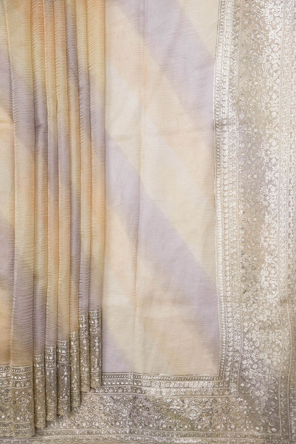 Pleats and pallu of Sandal Dual Tone Organza Silk Saree with Zari Brocade on the body and Embroidery Border. 