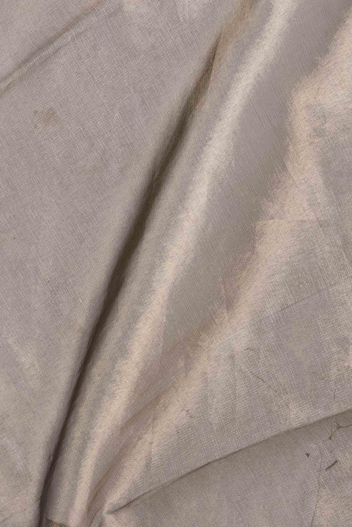 Close up of Gold Dual Tone Organza Silk Saree with Plain Body and Embroidery Border displaying folds