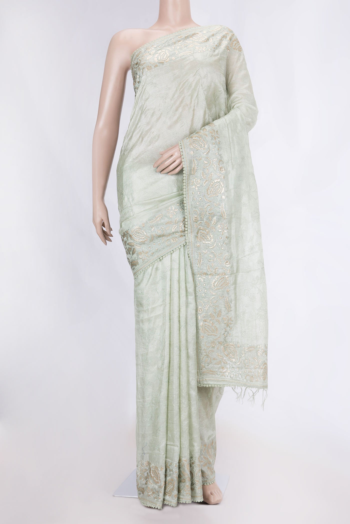 Pista Green Dual Tone Tussar Saree with Embroidery on the body and Embroidery Border displayed on a mannequin