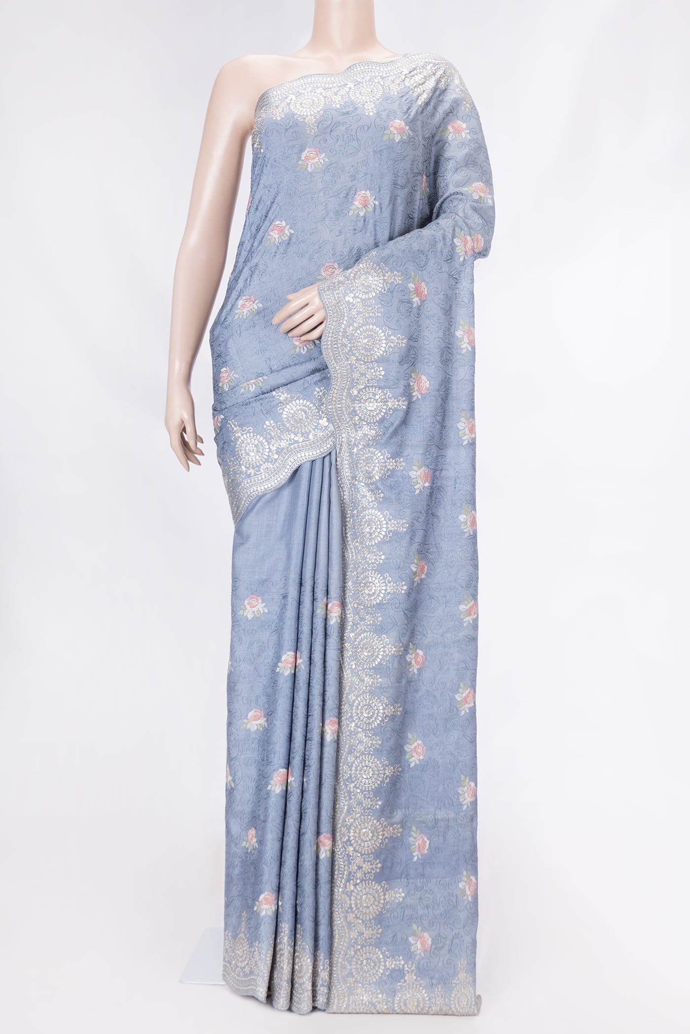 Blue Grey Tussar Silk Saree with Embroidery on the body and Embroidery Border displayed on a mannequin