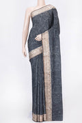 Black Dual Tone Tussar Silk Saree with Printed design on the body and Zari Border displayed on a mannequin