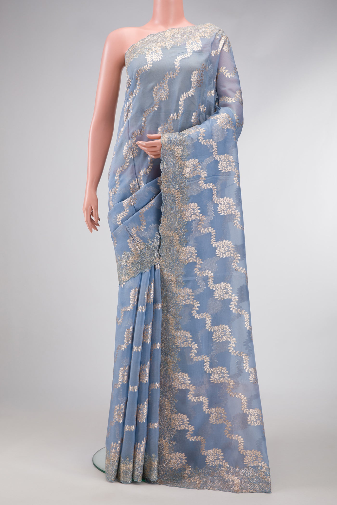 Maya Blue Dual Tone Organza Silk Saree with Stripes on the body and Embroidery Border.  displayed on a mannequin