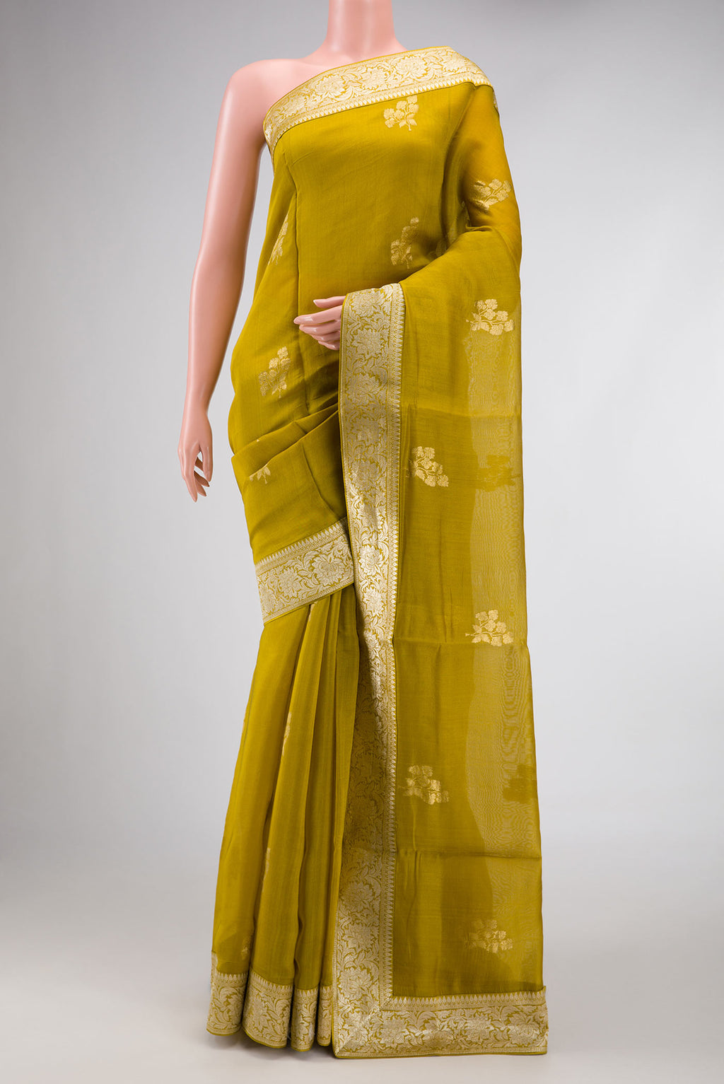 Mehandi Green Dual Tone Organza Silk Saree with Zari Butta on the body and Zari Border.  displayed on a mannequin
