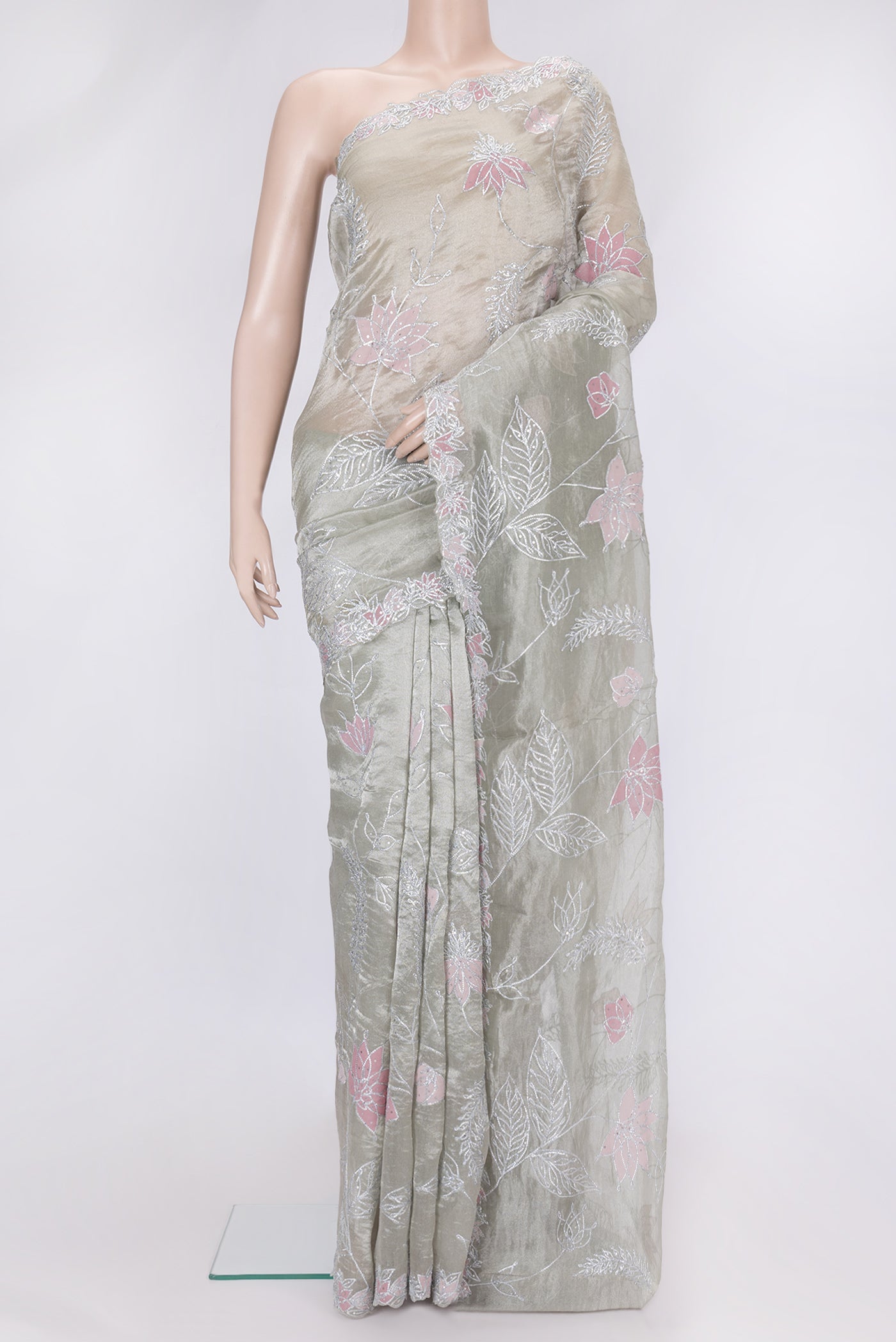 Pista Green Dual Tone Organza Silk Saree with Embroidery on the body and Embroidery Border.  displayed on a mannequin