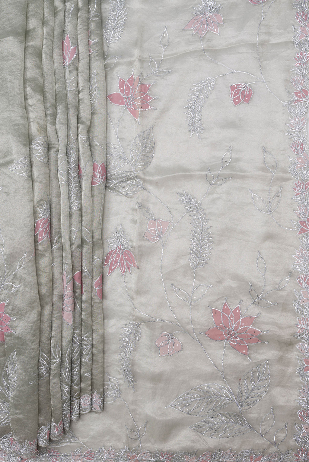 Pleats and pallu of Pista Green Dual Tone Organza Silk Saree with Embroidery on the body and Embroidery Border. 