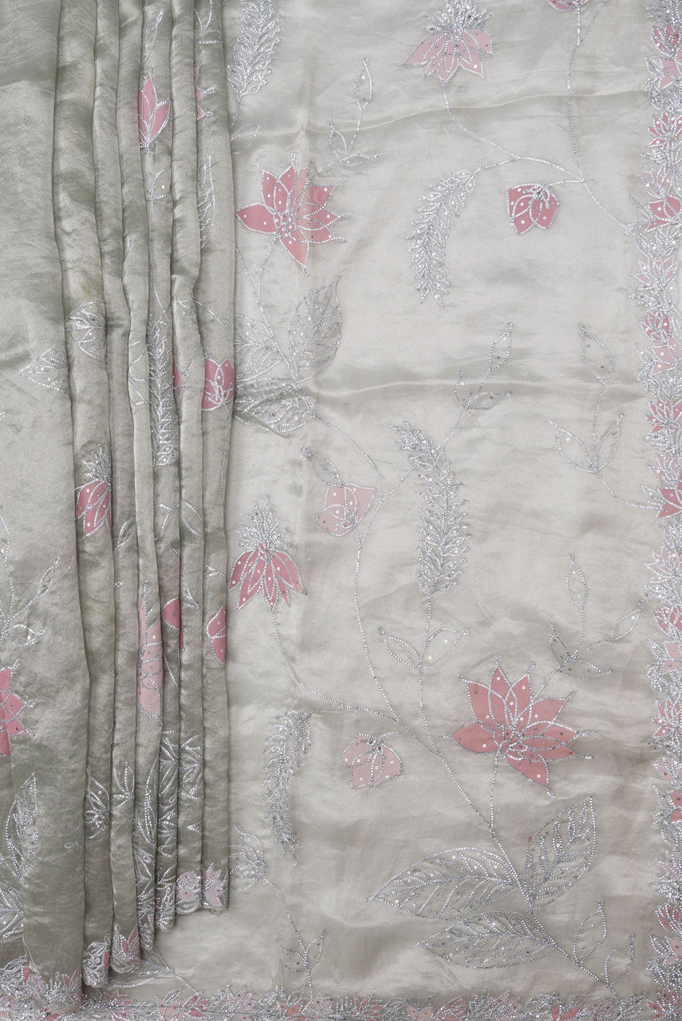Pleats and pallu of Pista Green Dual Tone Organza Silk Saree with Embroidery on the body and Embroidery Border. 