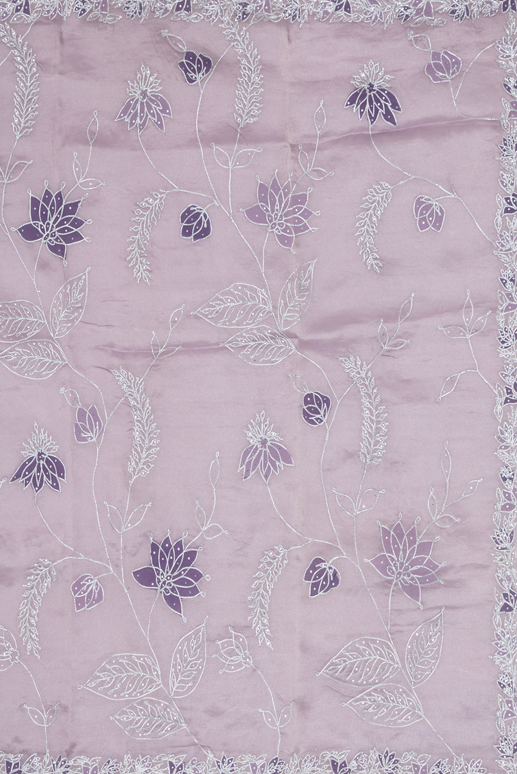 Close up image of the pallu of Lavender Dual Tone Organza Silk Saree with Embroidery on the body and Embroidery Border. 