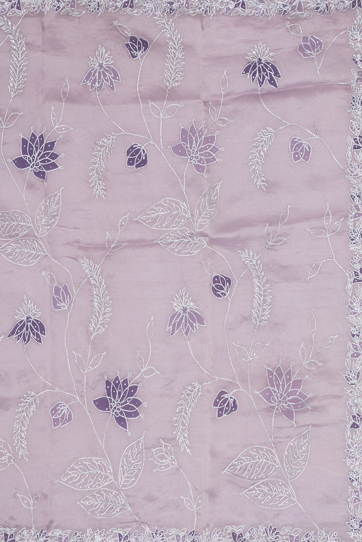 Close up image of the pallu of Lavender Dual Tone Organza Silk Saree with Embroidery on the body and Embroidery Border. 