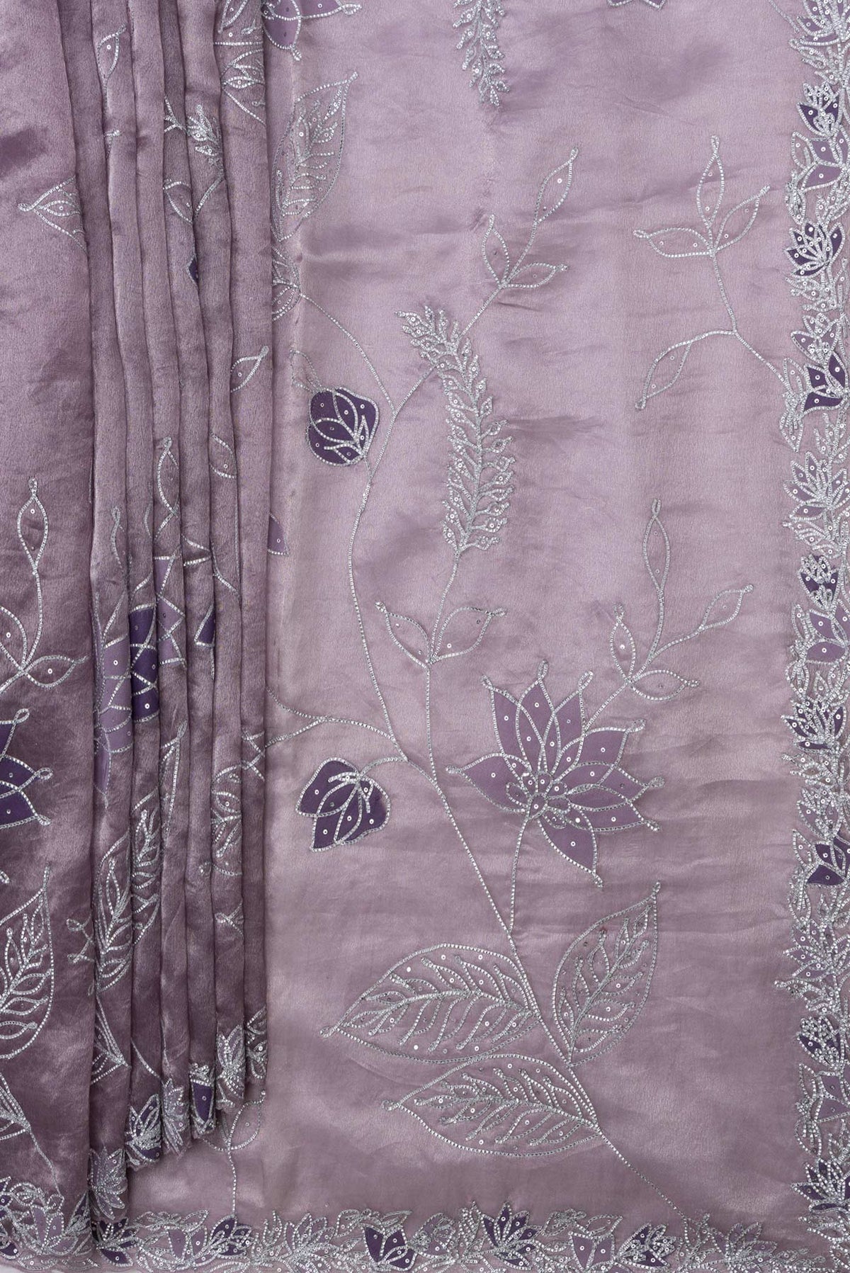 Pleats and pallu of Lavender Dual Tone Organza Silk Saree with Embroidery on the body and Embroidery Border. 
