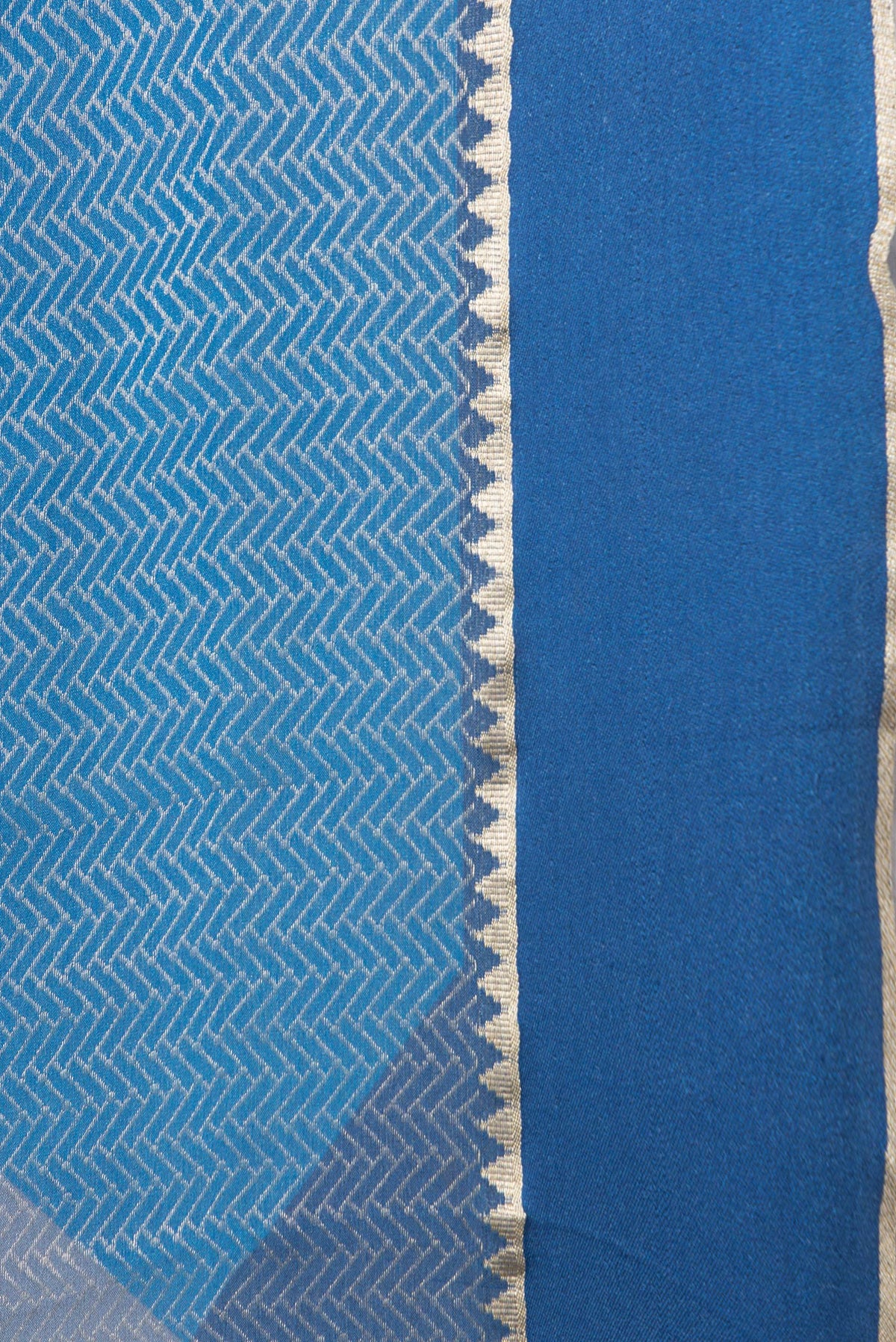 Border image of Navy Blue and Sky Blue Color Mysore Georgette Saree with Zari Brocade on the body and Zari Border. 