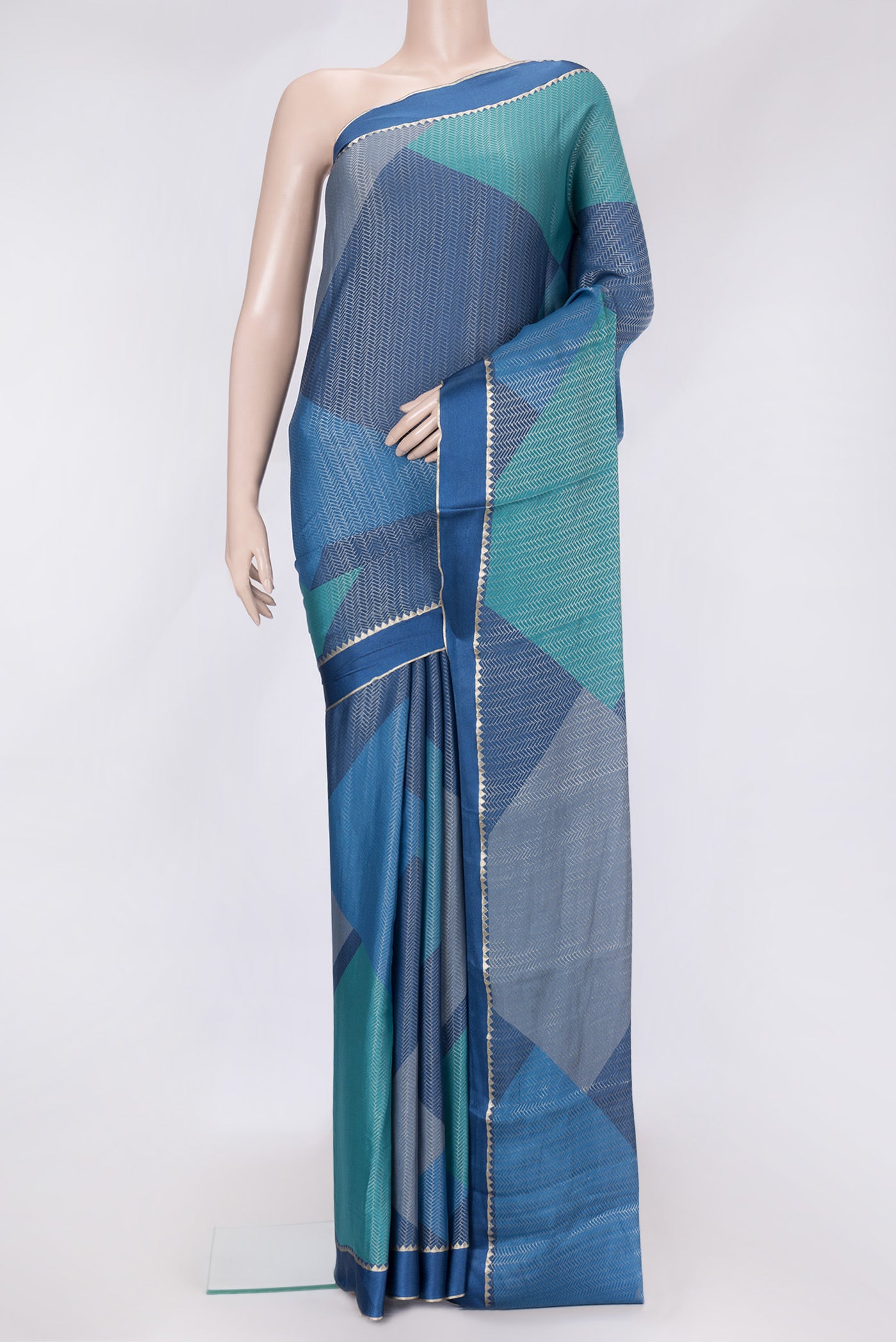 Navy Blue and Sky Blue Color Mysore Georgette Saree with Zari Brocade on the body and Zari Border.  displayed on a mannequin