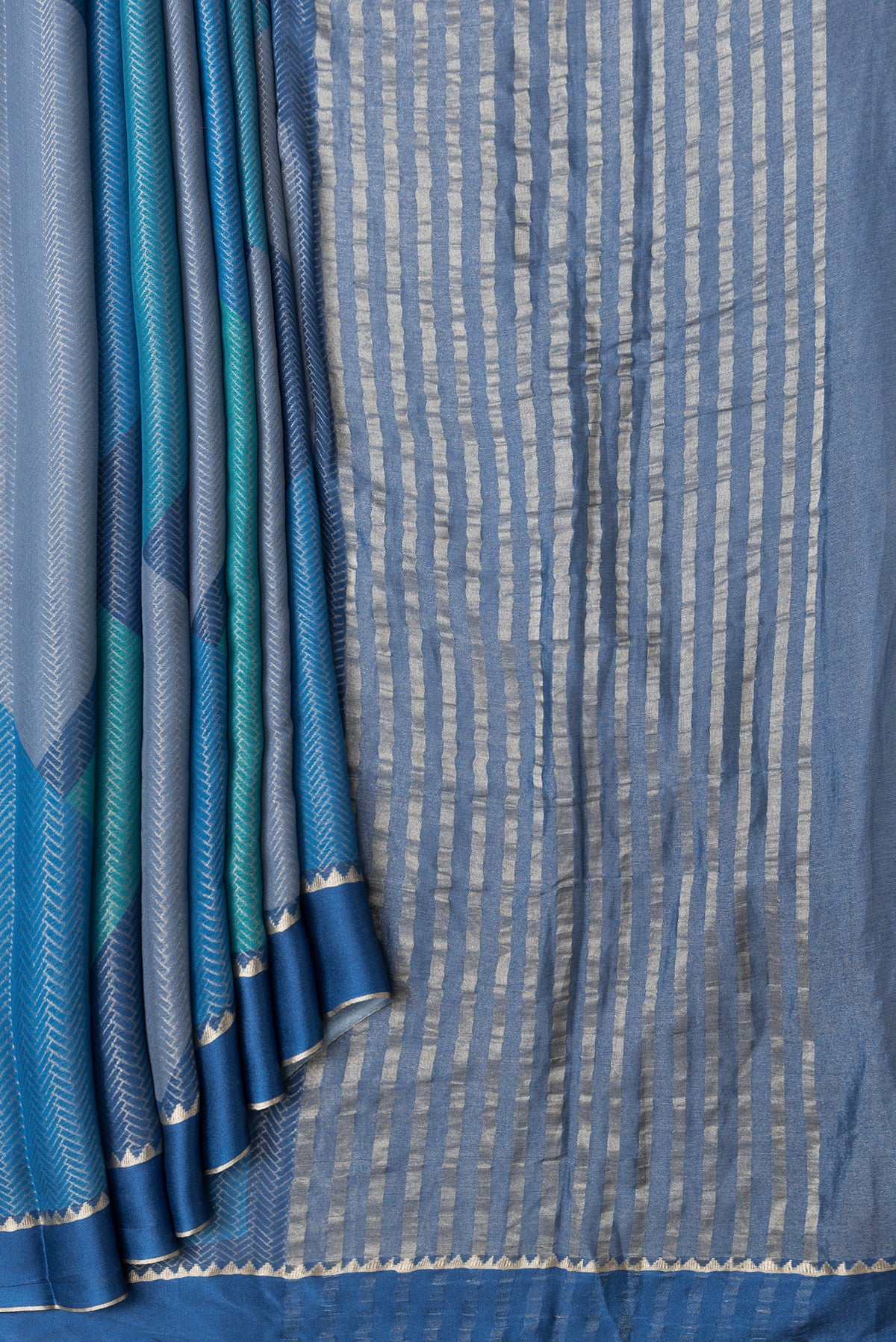 Pleats and pallu of Navy Blue and Sky Blue Color Mysore Georgette Saree with Zari Brocade on the body and Zari Border. 