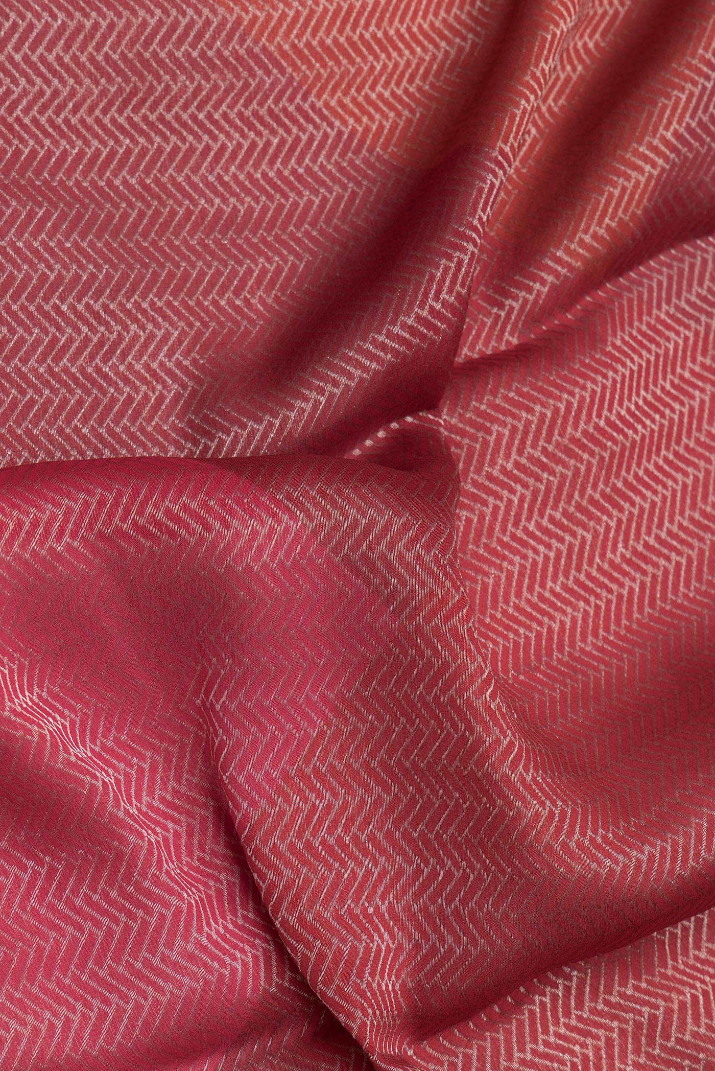 Close up of Red Mysore Crepe Saree with Zari Brocade on the body and Zari Border.  displaying folds