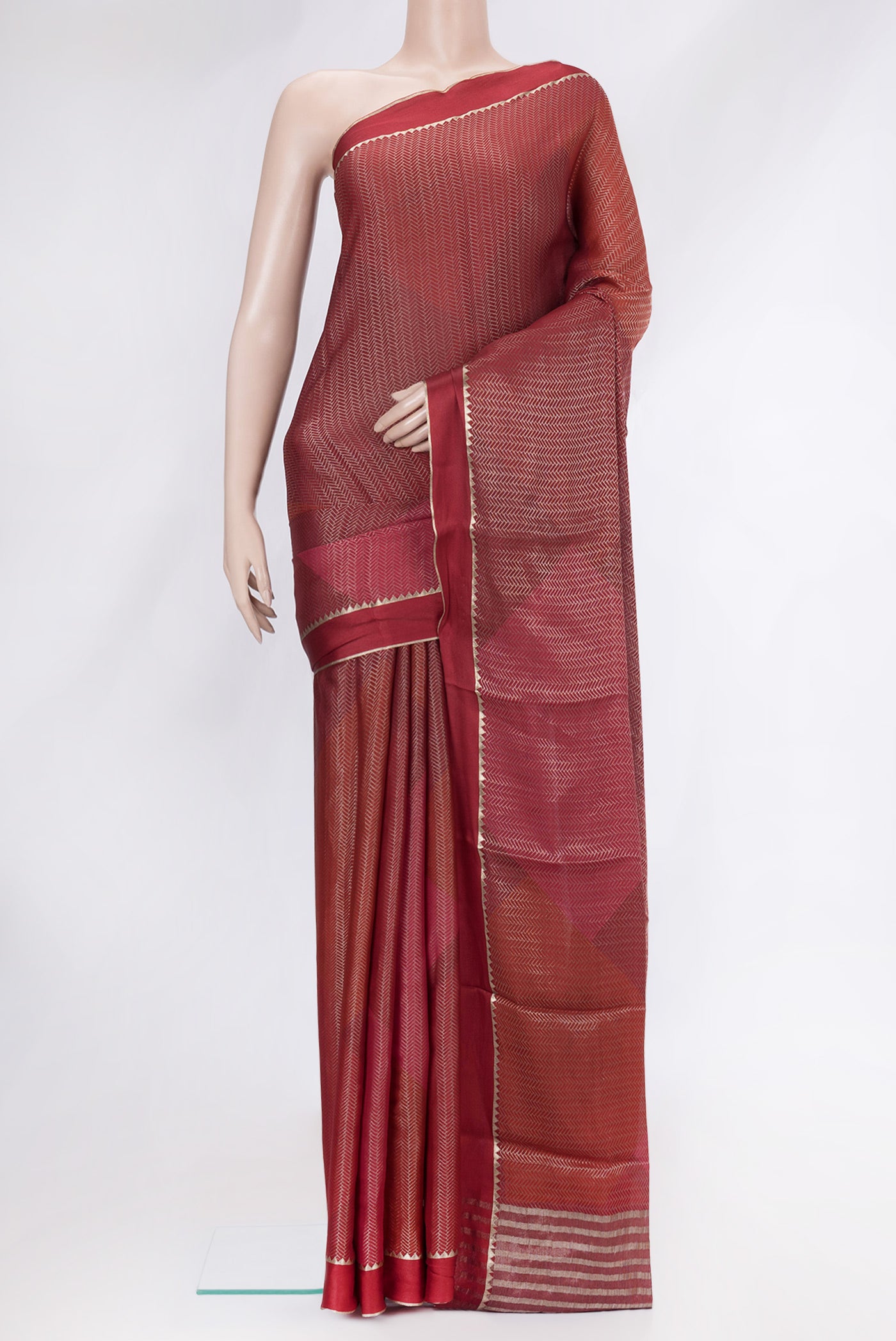 Red Mysore Crepe Saree with Zari Brocade on the body and Zari Border.  displayed on a mannequin