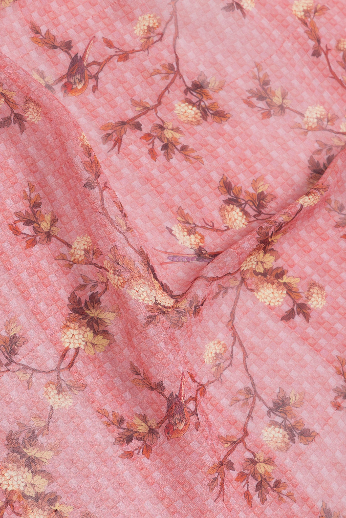 Close up of Peach Dual Tone Mysore Georgette Saree with Printed design on the body and Zari Border.  displaying folds