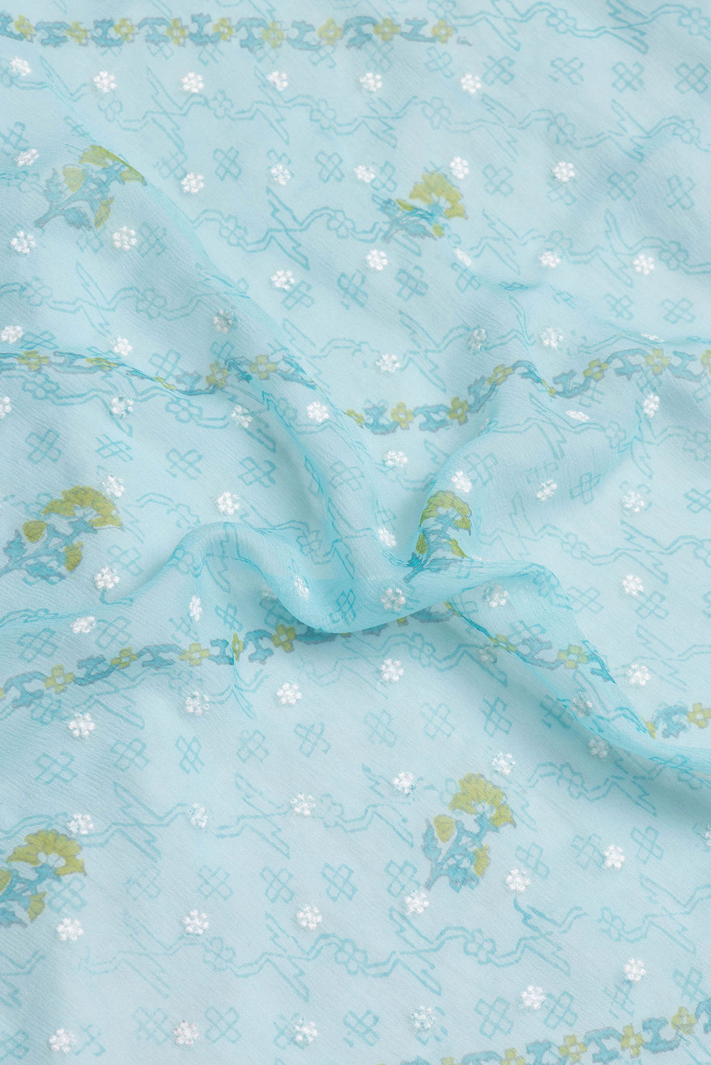 Close up of Sky Blue Dual Tone Chiffon Saree with Embroidery on the body and Zari Border.  displaying folds