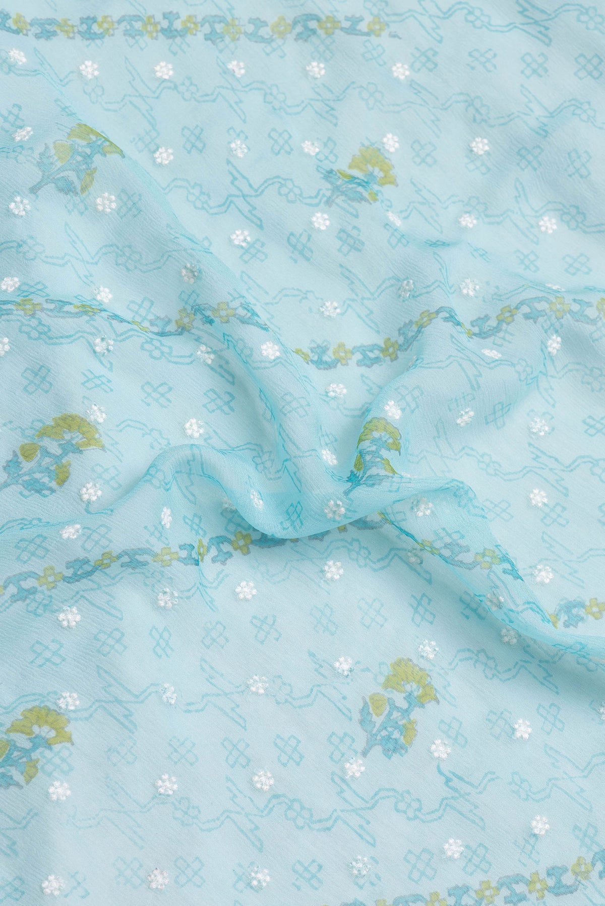 Close up of Sky Blue Dual Tone Chiffon Saree with Embroidery on the body and Zari Border.  displaying folds