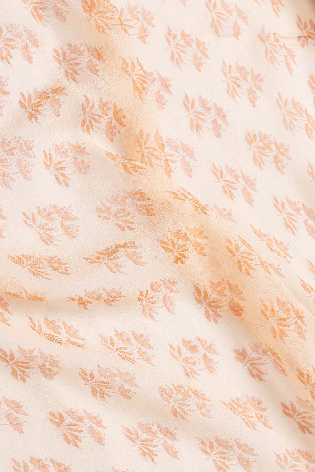 Close up of Sandal Dual Tone Mysore Chiffon Saree with Printed design on the body and Zari Border.  displaying folds