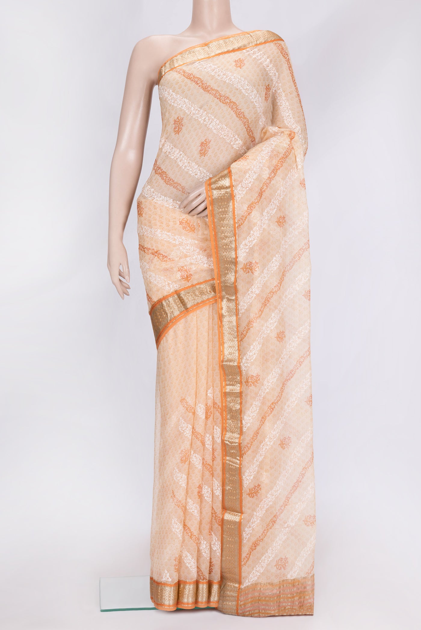 Golden Peach Dual Tone Mysore Chiffon Saree with Printed design on the body and Zari Border.  displayed on a mannequin