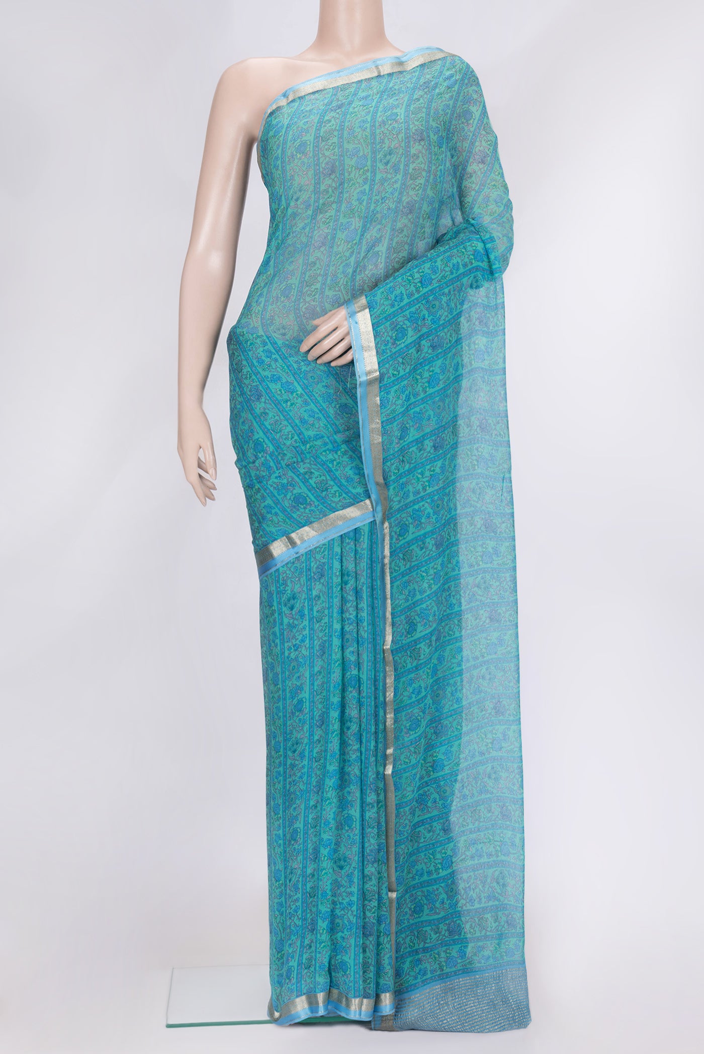 Sea Green Dual Tone Mysore Chiffon Saree with Printed design on the body and Zari Border.  displayed on a mannequin