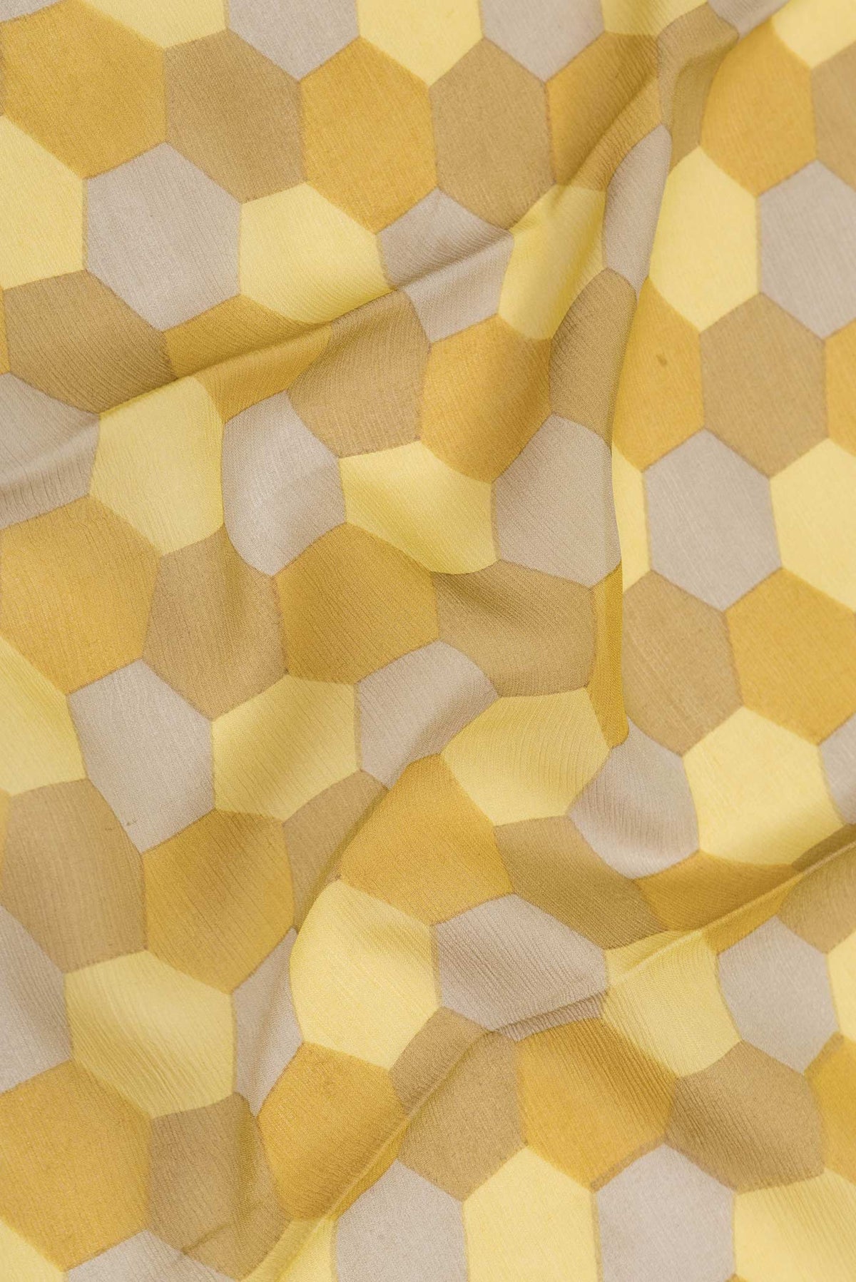 Close up of Mustard Dual Tone Mysore Crepe Saree with Printed design on the body and Zari Border displaying folds