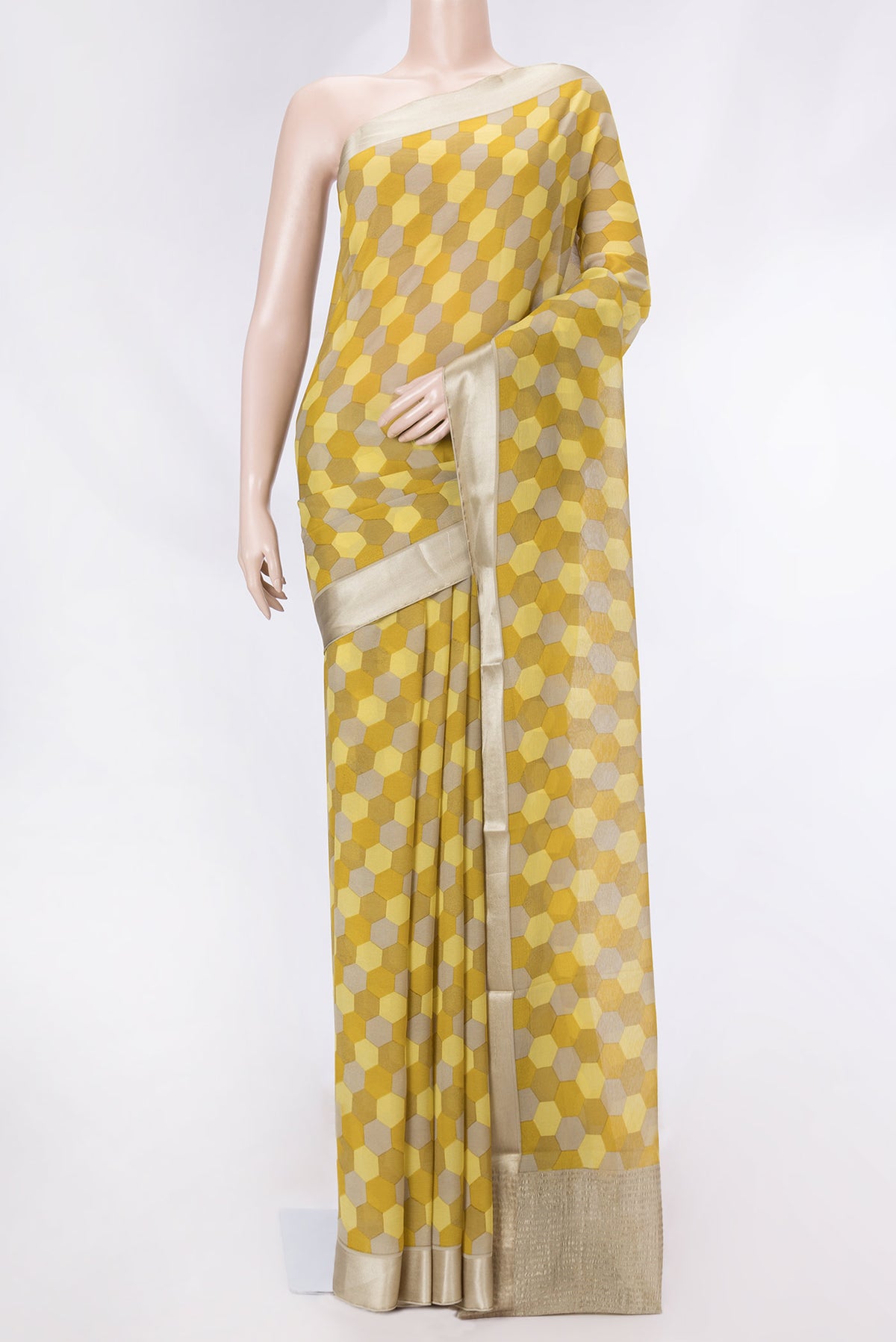 Mustard Dual Tone Mysore Crepe Saree with Printed design on the body and Zari Border displayed on a mannequin