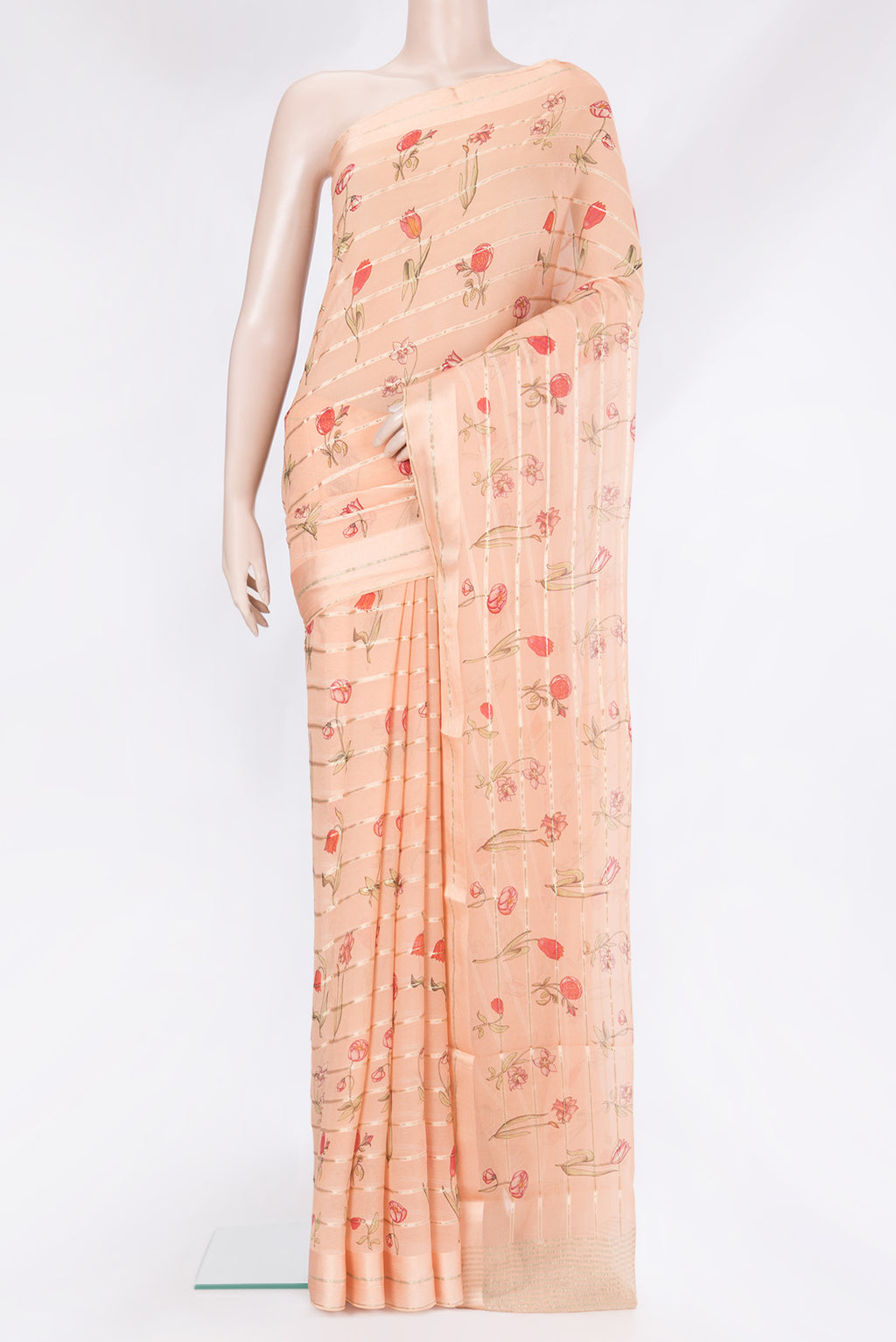 Peach Mysore Chiffon Saree with Stripes on the body and Zari Border.  displayed on a mannequin