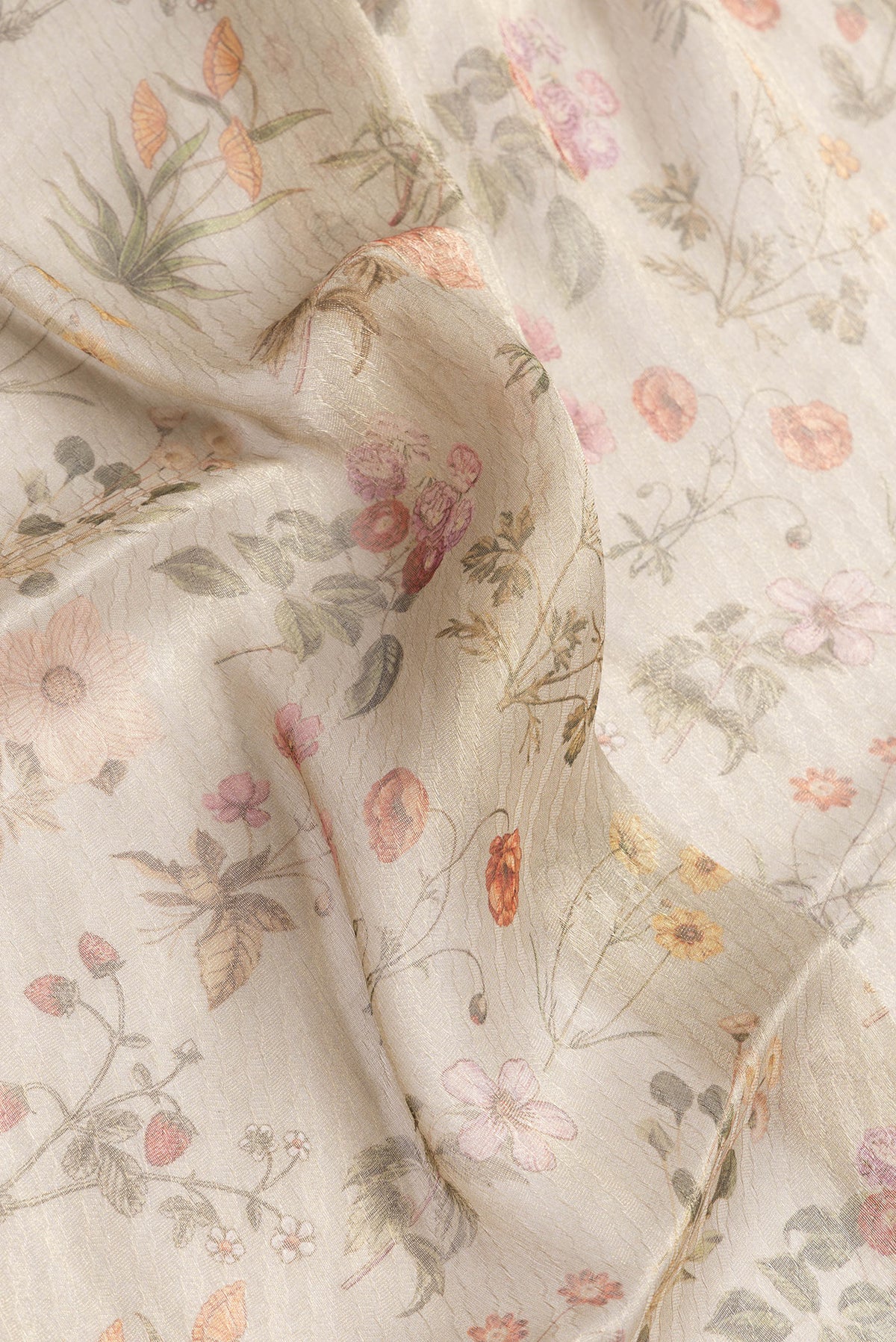 Close up of Beige Dual Tone Mysore Georgette Saree with Printed design on the body and Fancy Border.  displaying folds