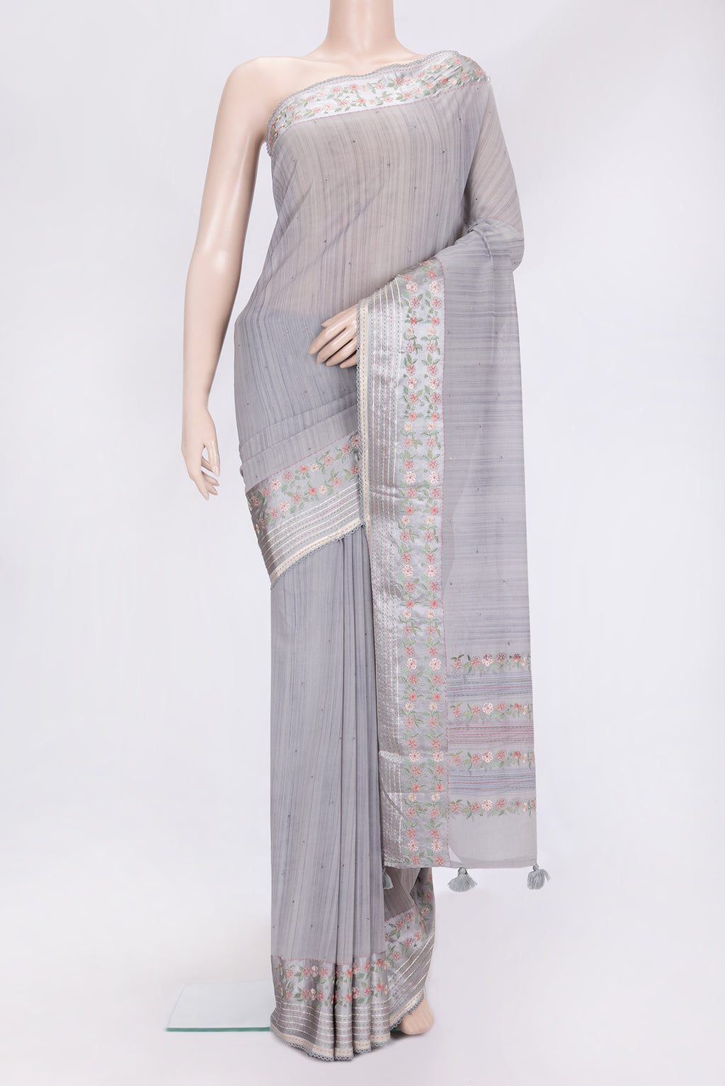 Grey Dual Tone Georgette Saree with Embroidery on the body and Embroidery Border.  displayed on a mannequin