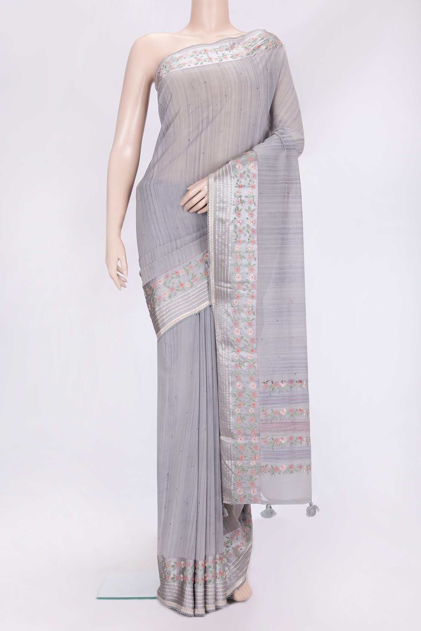 Grey Dual Tone Georgette Saree with Embroidery on the body and Embroidery Border.  displayed on a mannequin