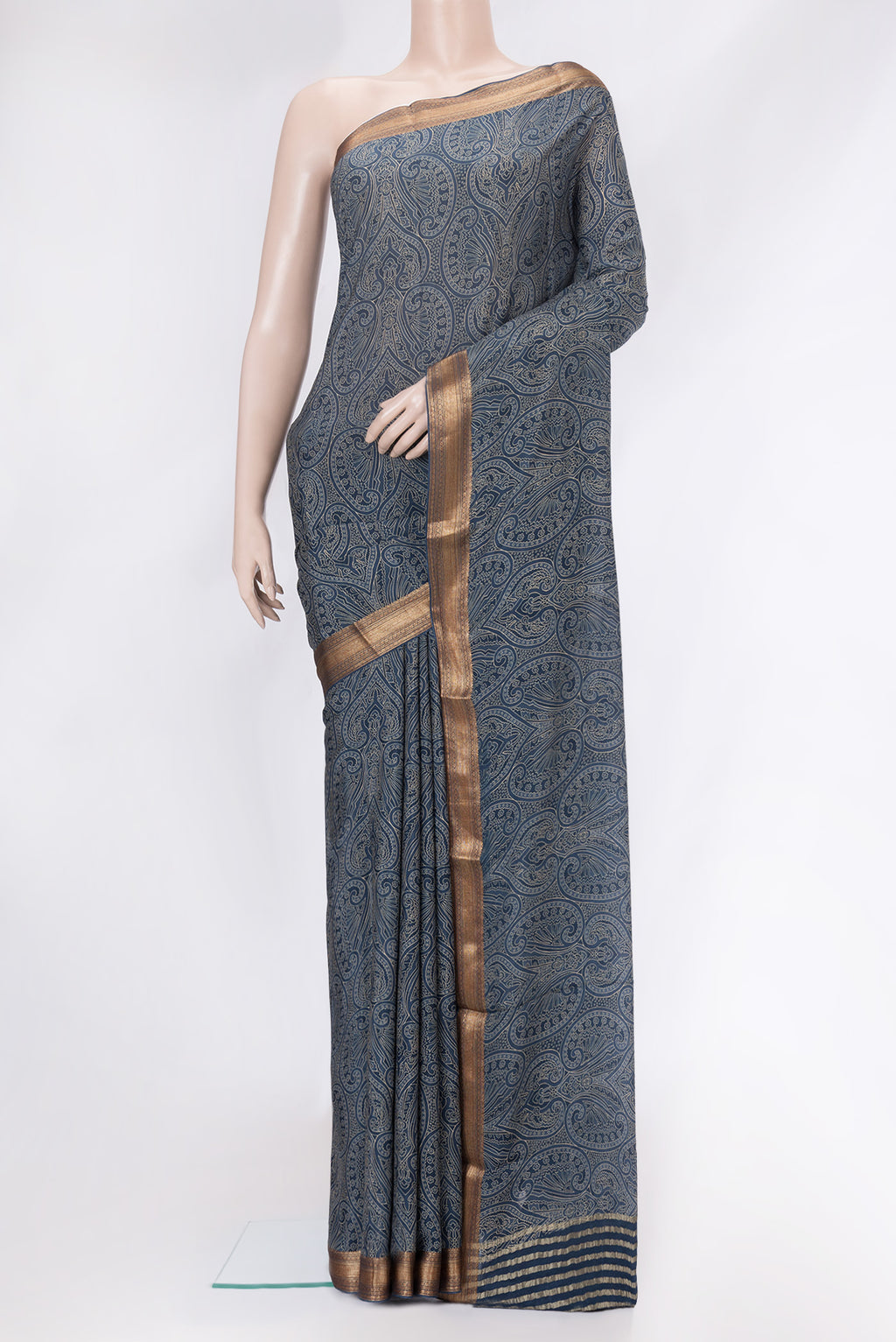 Grey Mysore Crepe Saree with Printed design on the body and Zari Border.  displayed on a mannequin