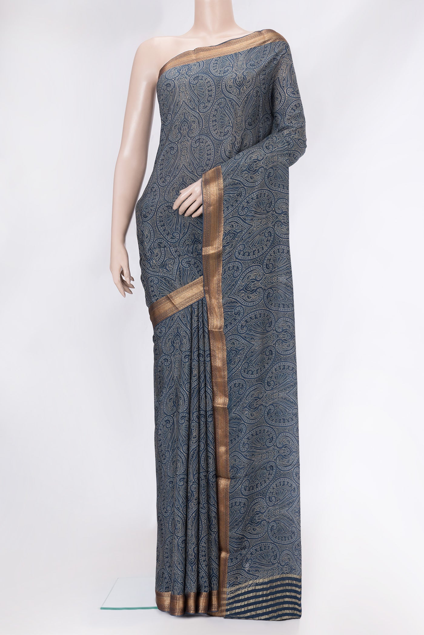 Grey Mysore Crepe Saree with Printed design on the body and Zari Border.  displayed on a mannequin