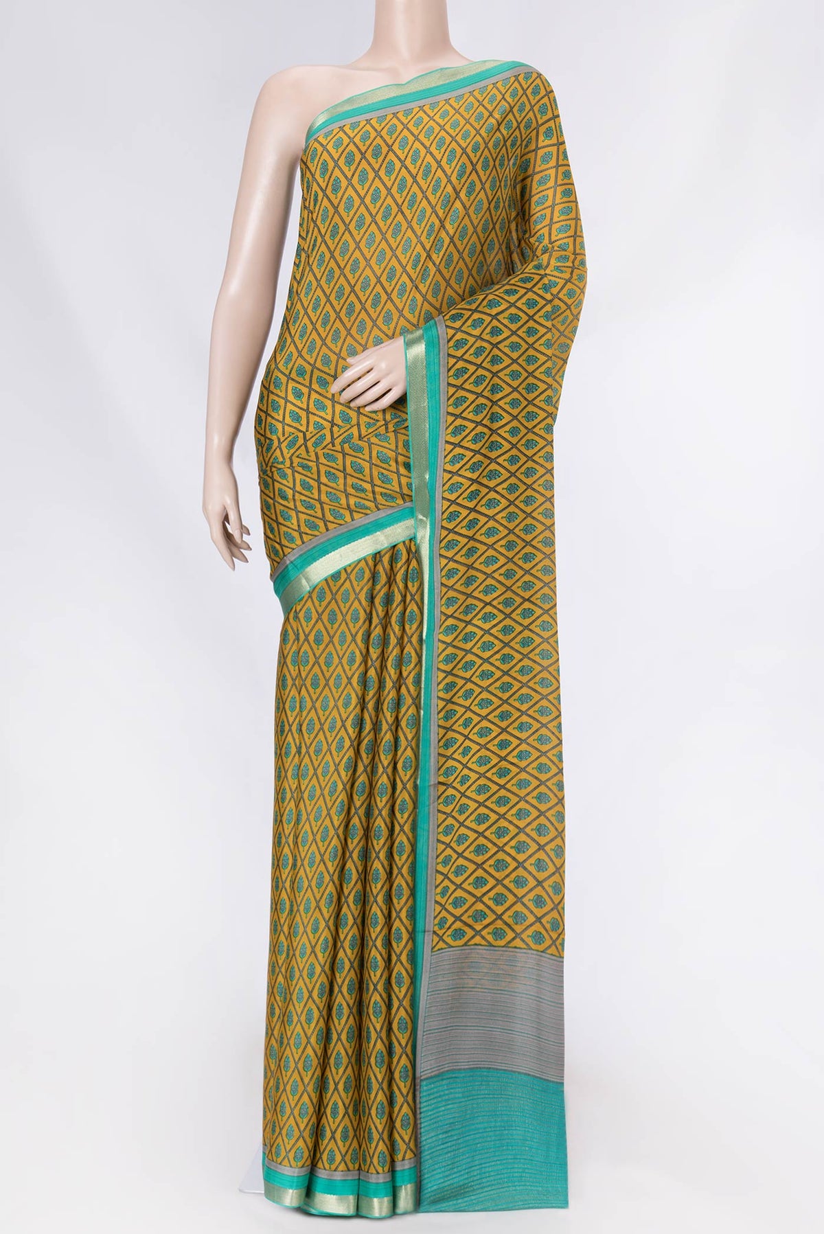 Mustard Dual Tone Mysore Crepe Saree with Printed design on the body and Zari Border displayed on a mannequin