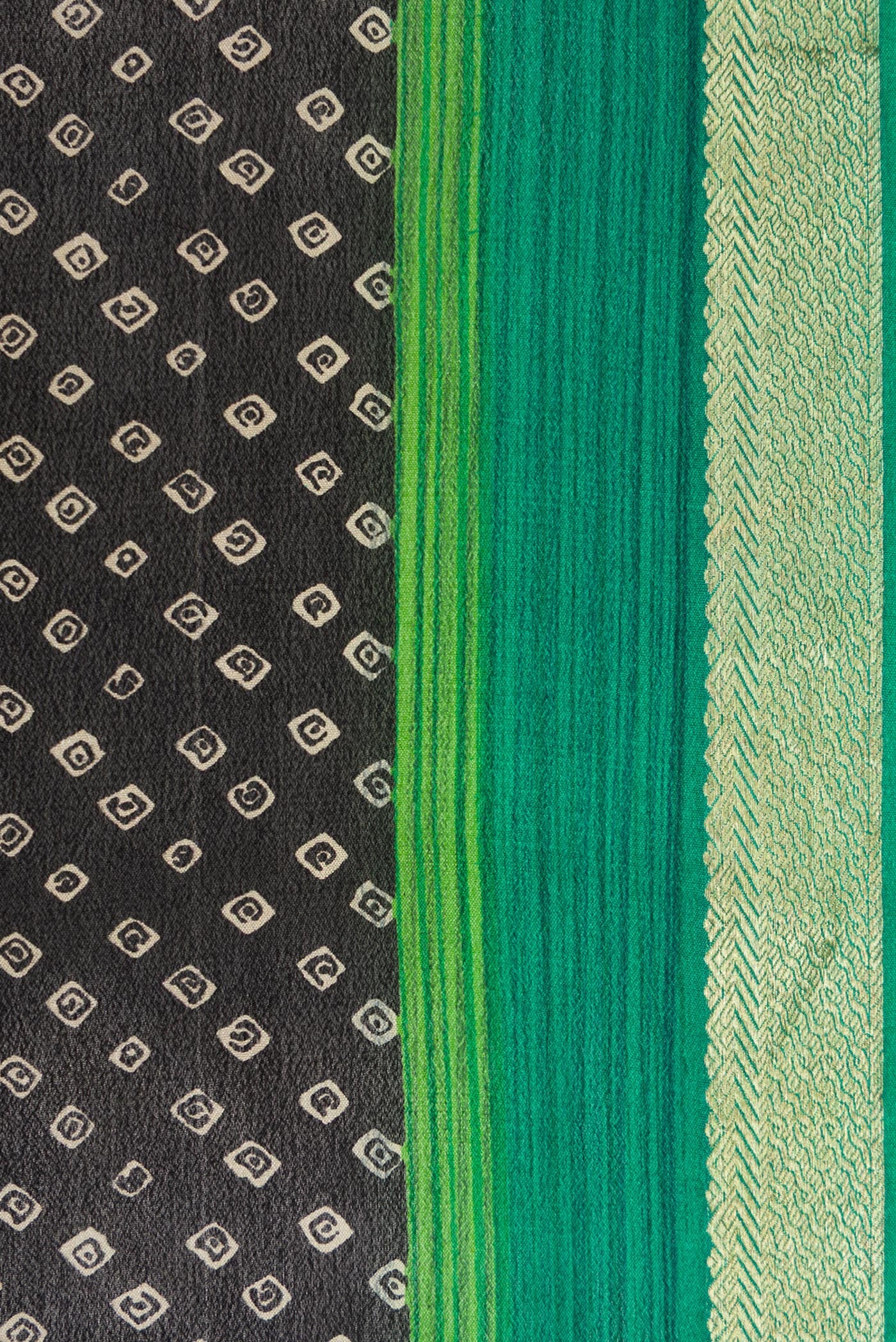 Border image of Black Dual Tone Mysore Crepe Saree with Bandhani Print on the body and Zari Border. 