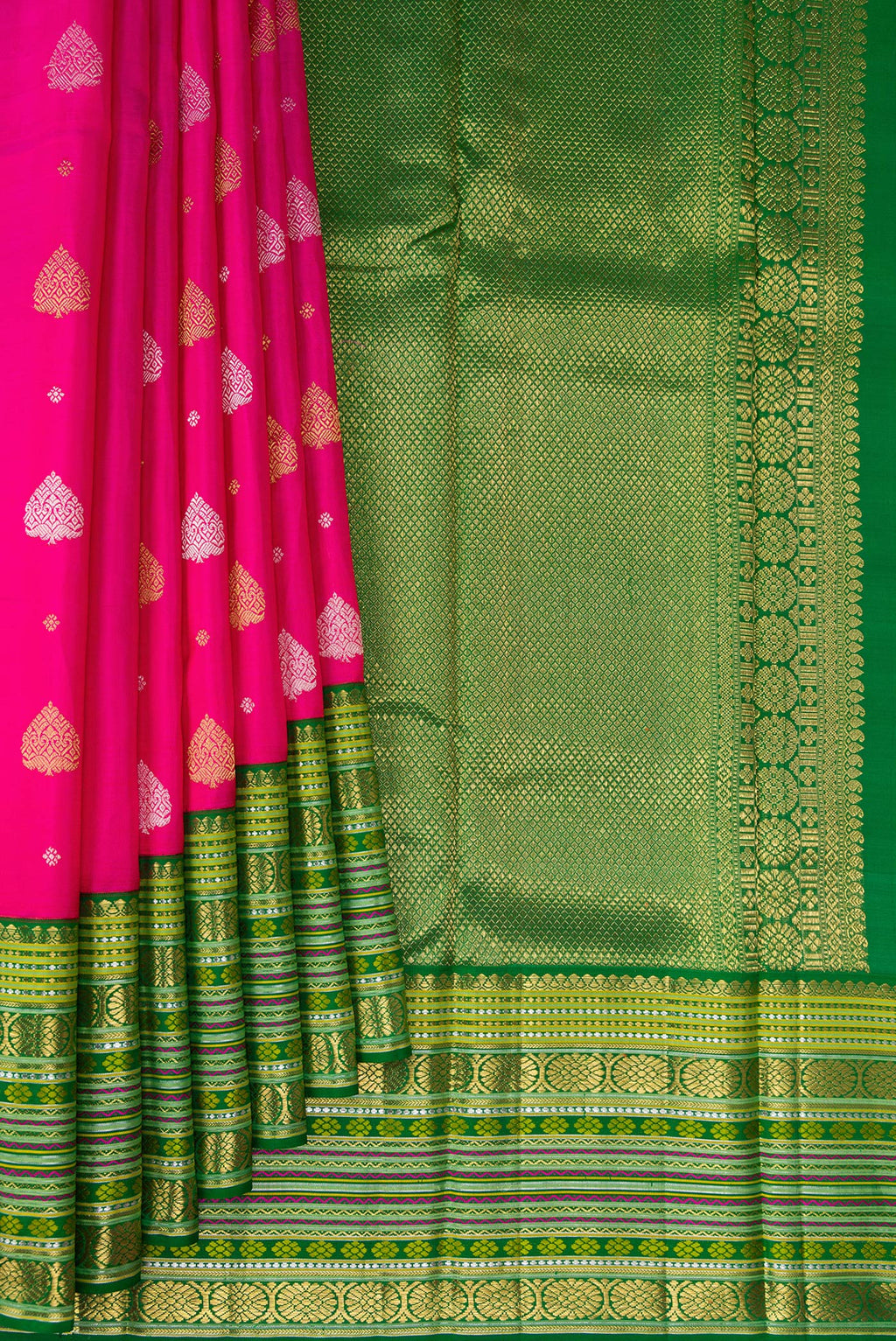 Pleats and pallu of Pure Silk Pure Zari Rani Pink Kanchipuram Saree with Zari Butta on the body and Zari Border. 