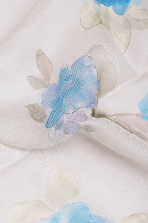 Close up of Beige Kota Silk Saree with Printed design on the body and Zari Border.  displaying folds
