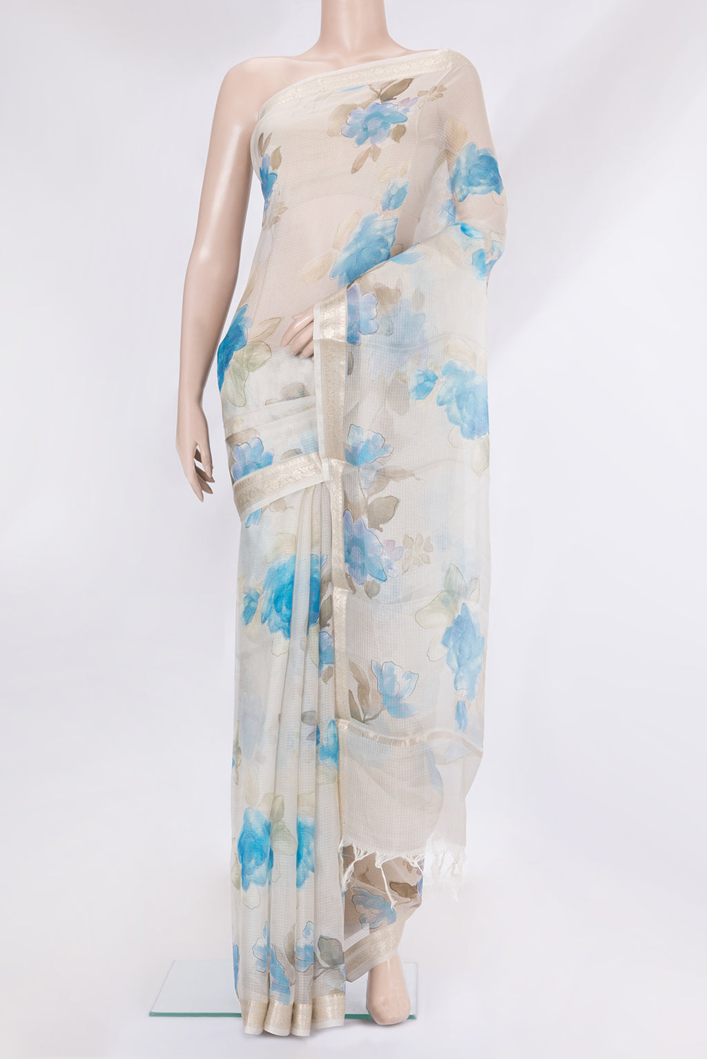 Beige Kota Silk Saree with Printed design on the body and Zari Border.  displayed on a mannequin