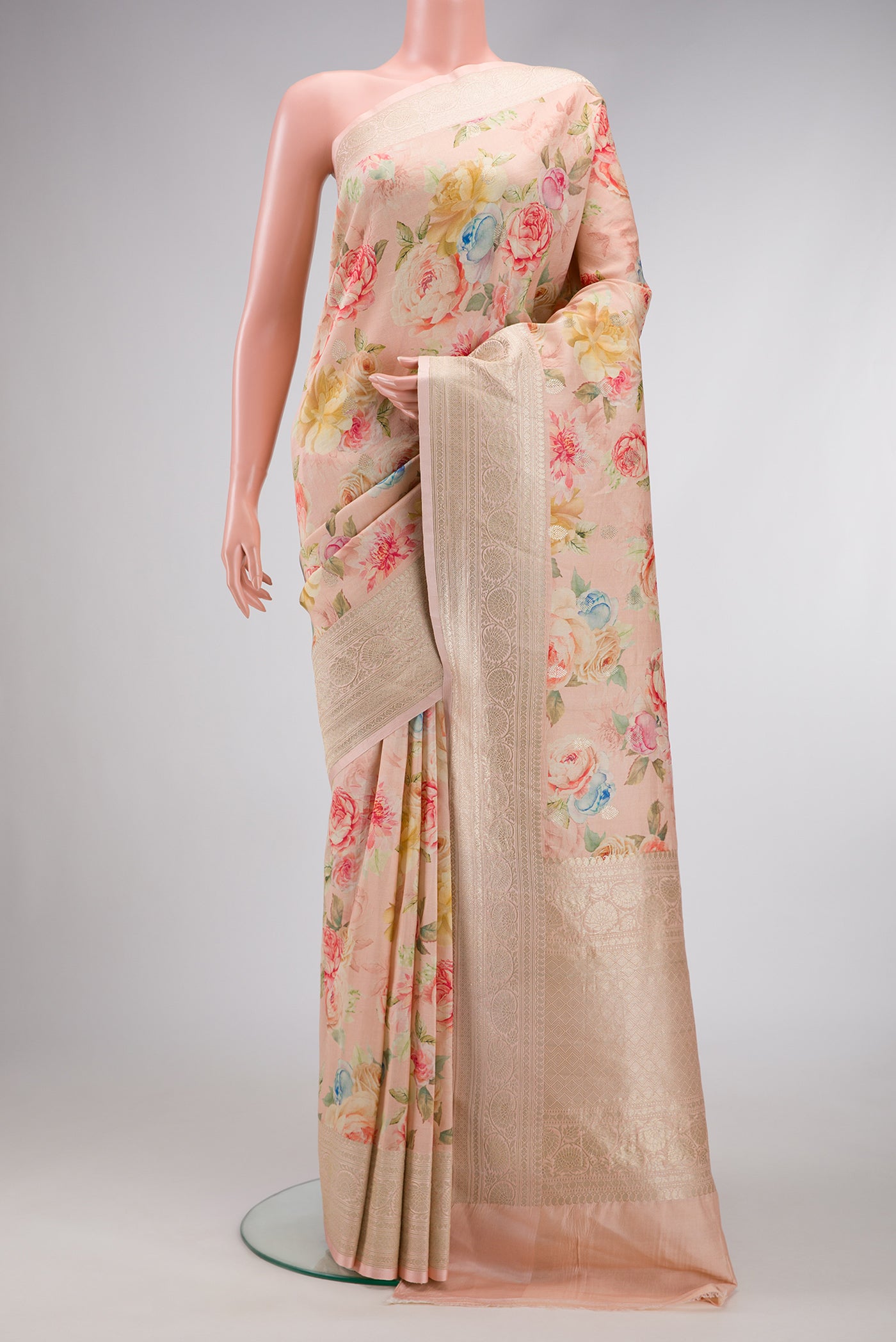 Peach Dual Tone Tussar Silk Saree with Printed design on the body and Zari Border.  displayed on a mannequin