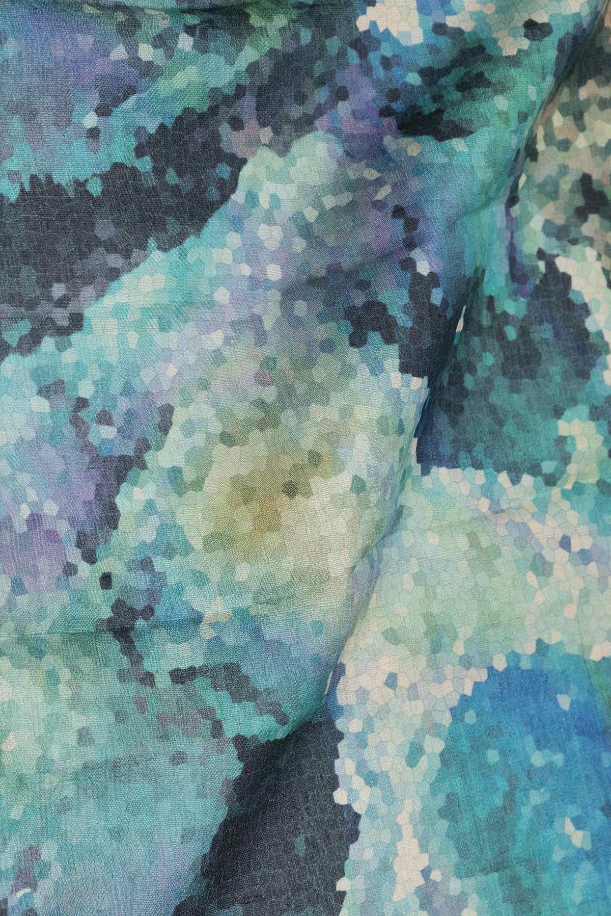Close up of Sky Blue Dual Tone Tussar Silk Saree with Printed design on the body and Zari Border displaying folds