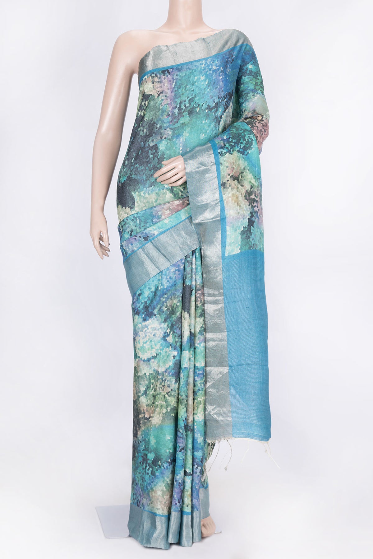 Sky Blue Dual Tone Tussar Silk Saree with Printed design on the body and Zari Border displayed on a mannequin