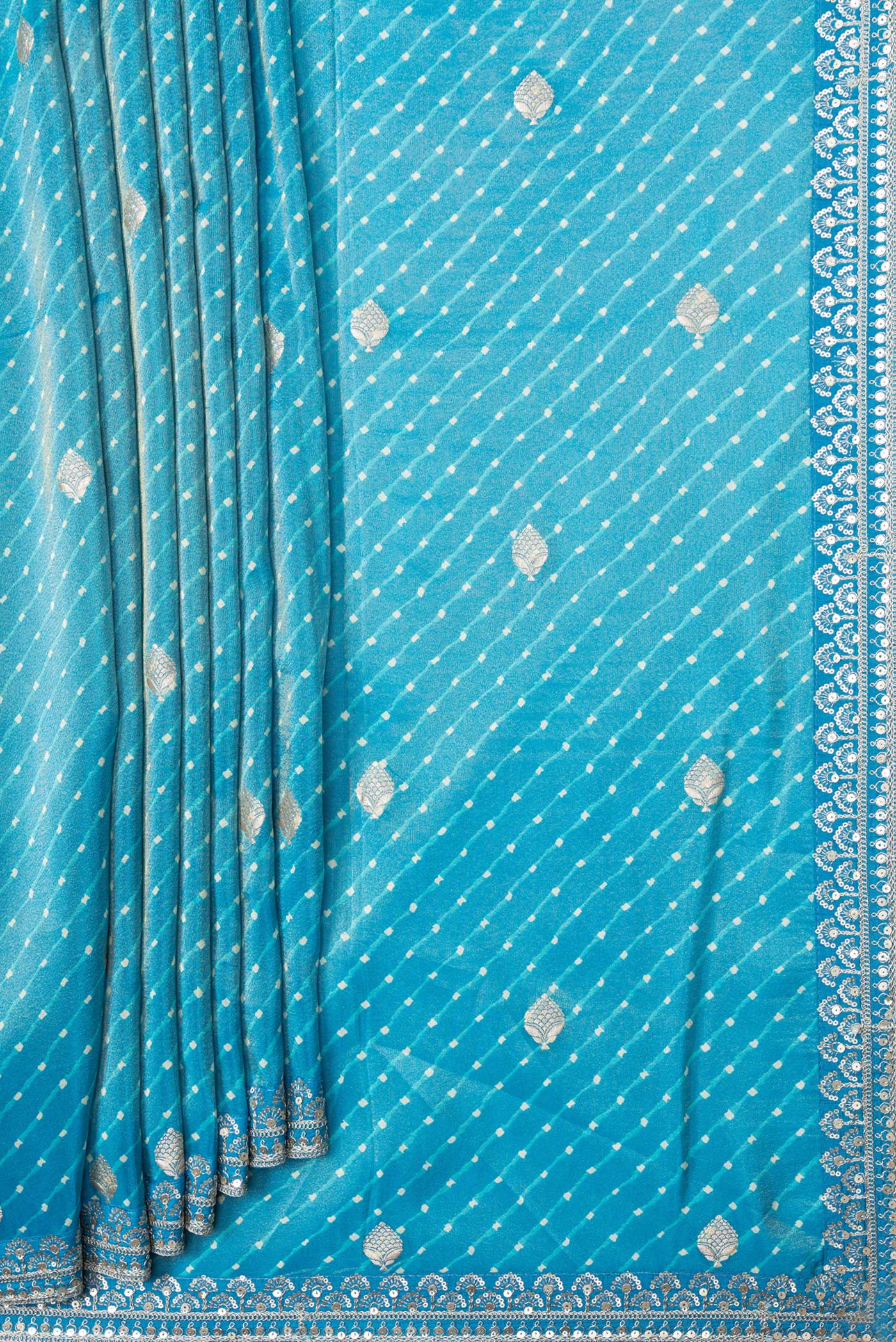 Pleats and pallu of Sky Blue Dual Tone Organza Silk Saree with Embroidery on the body and Embroidery Border. 