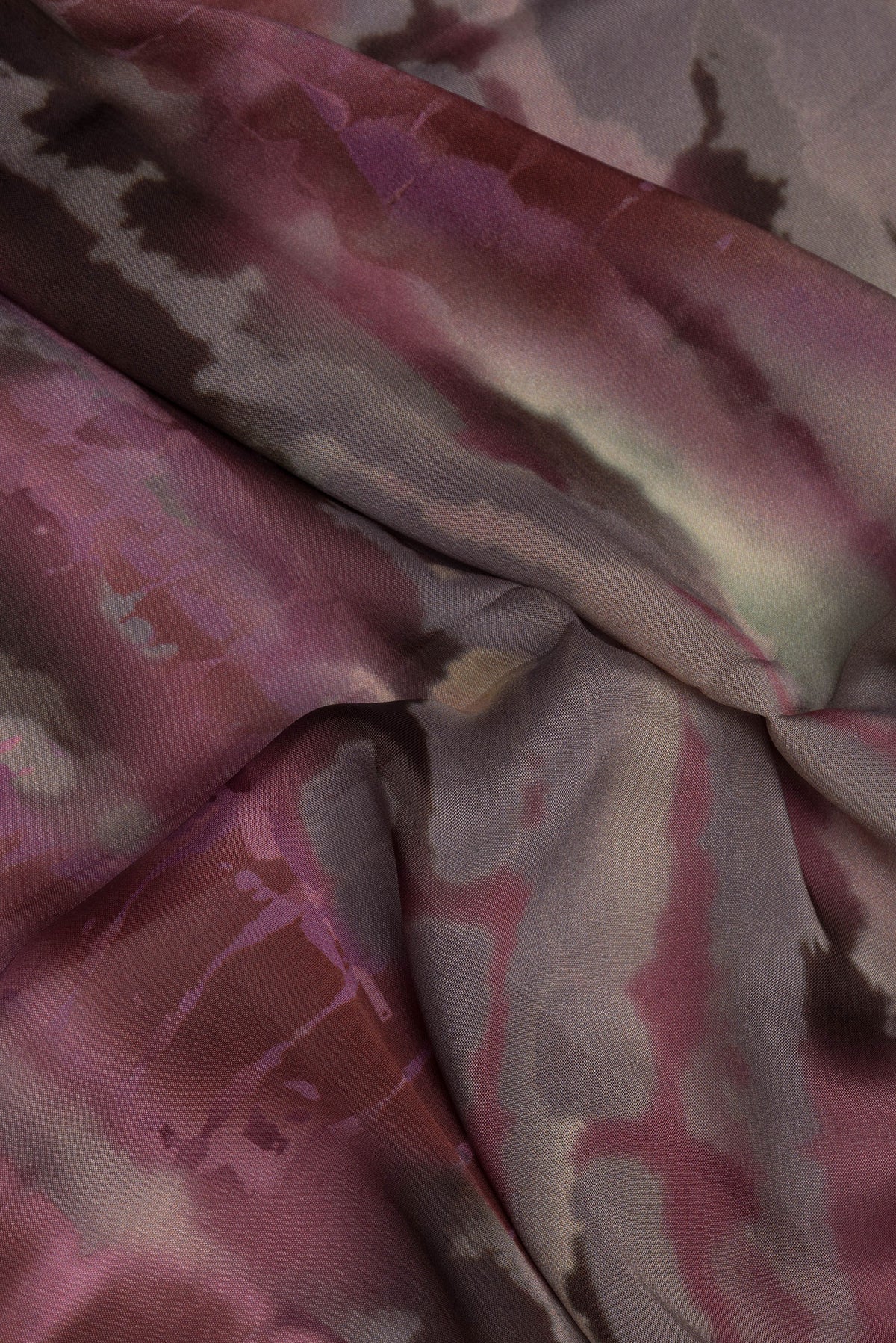 Close up of Brown Dual Tone Crepe Saree with Printed design on the body and Without Border.  displaying folds