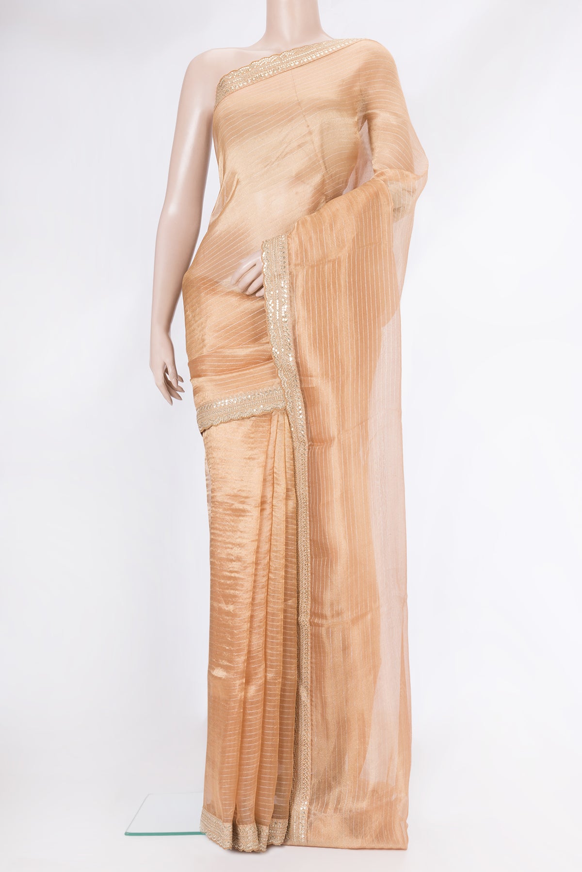 Golden Peach Dual Tone Organza Silk Saree with Stripes on the body and Embroidery Border.  displayed on a mannequin