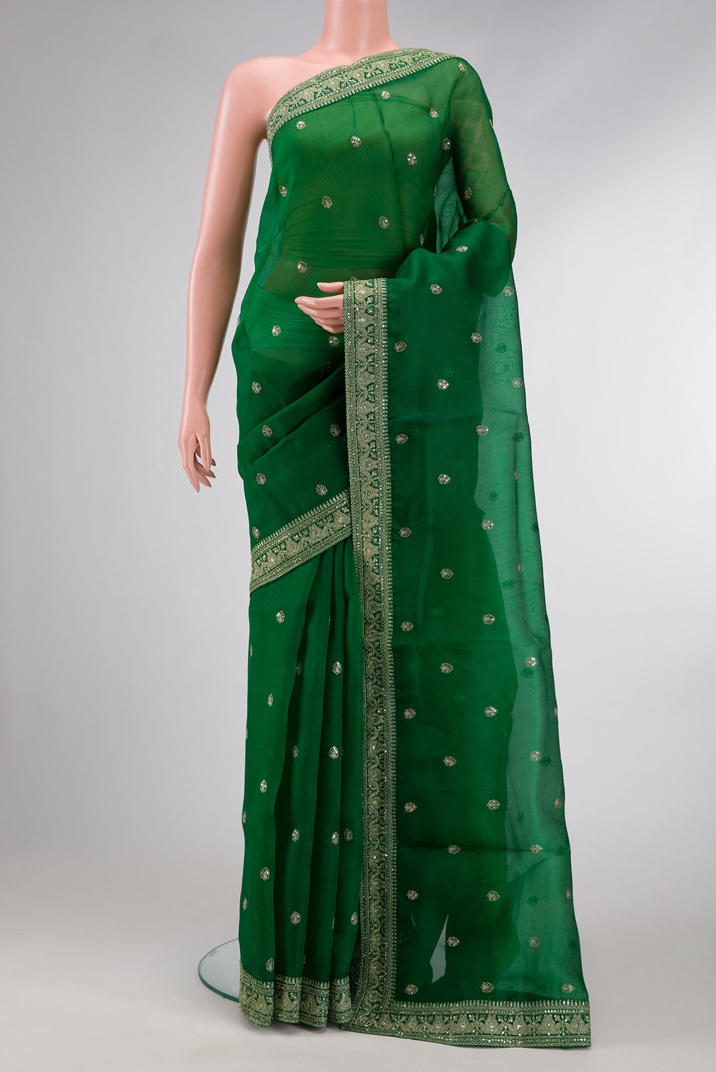 Bottle Green Dual Tone Organza Silk Saree with Embroidery on the body and Embroidery Border.  displayed on a mannequin