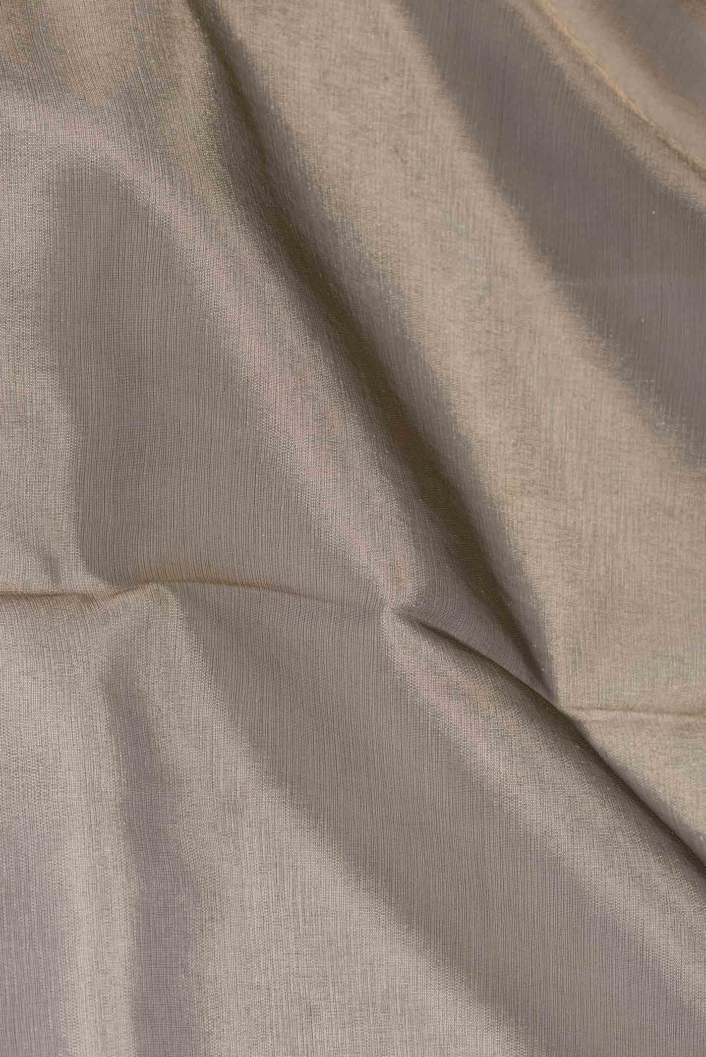 Close up of Gold Dual Tone Organza Silk Saree with Plain Body and Fancy Border displaying folds