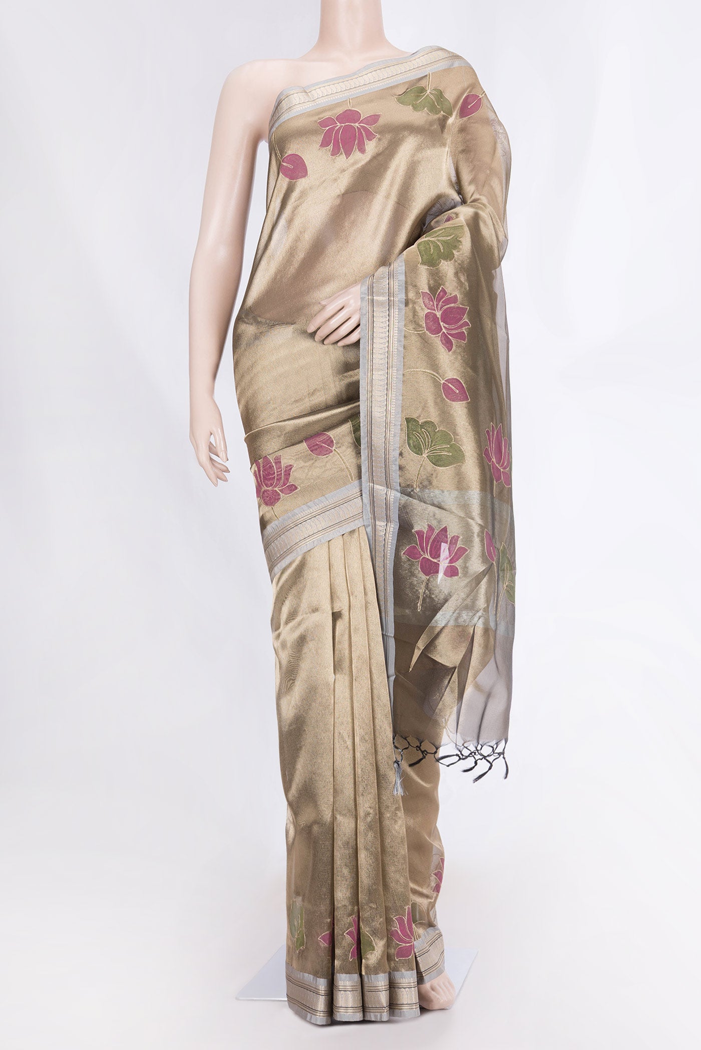 Gold Dual Tone Organza Silk Saree with Plain Body and Fancy Border displayed on a mannequin