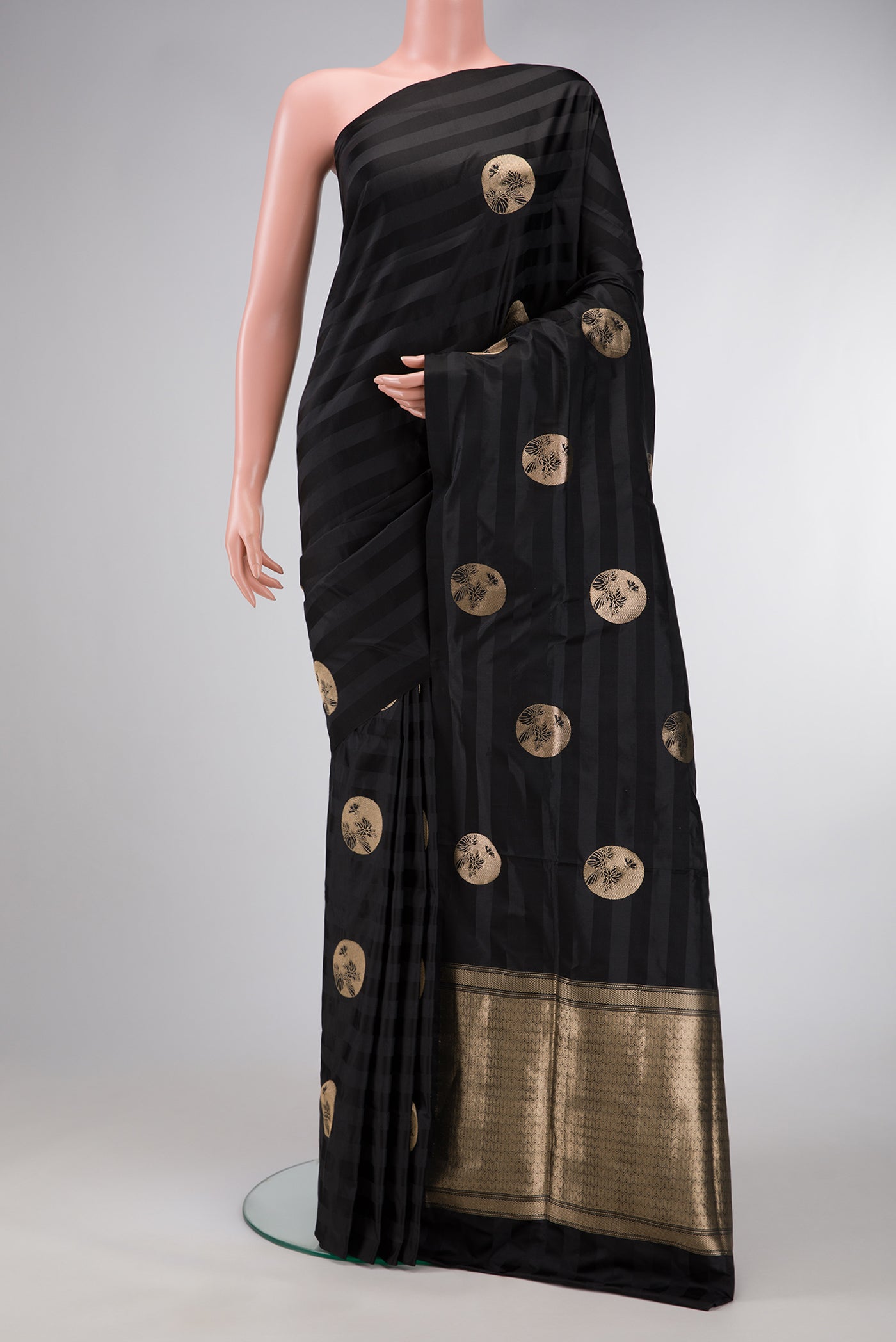 Black Dual Tone Banarasi Silk Saree with Zari Butta on the body and Without Border.  displayed on a mannequin
