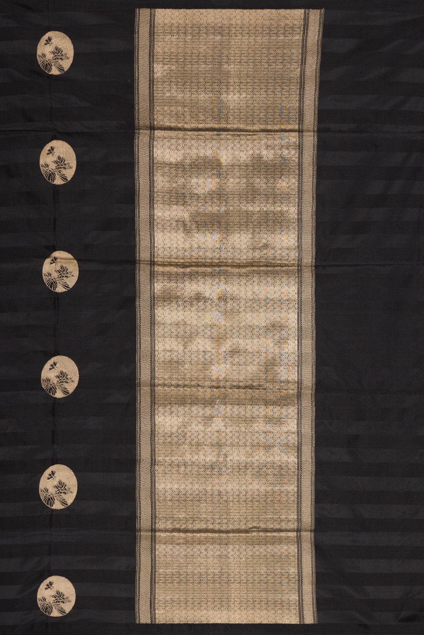 Close up image of the pallu of Black Dual Tone Banarasi Silk Saree with Zari Butta on the body and Without Border. 