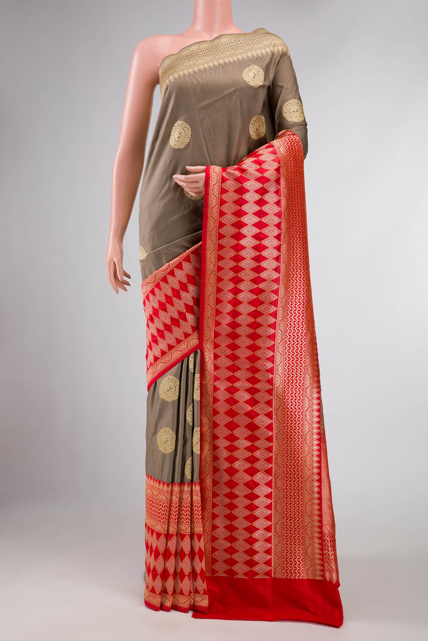 Pure Silk Pure Zari Grey Dual Tone Banarasi Saree with Zari Butta on the body and Fancy Border displayed on a mannequin
